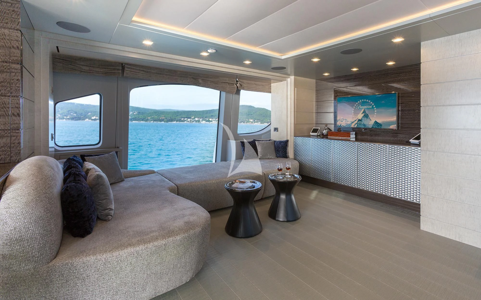 a living room with a large window aboard EDESIA Yacht for Sale