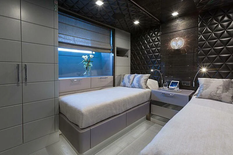 a room with a bed and a tv aboard EDESIA Yacht for Sale