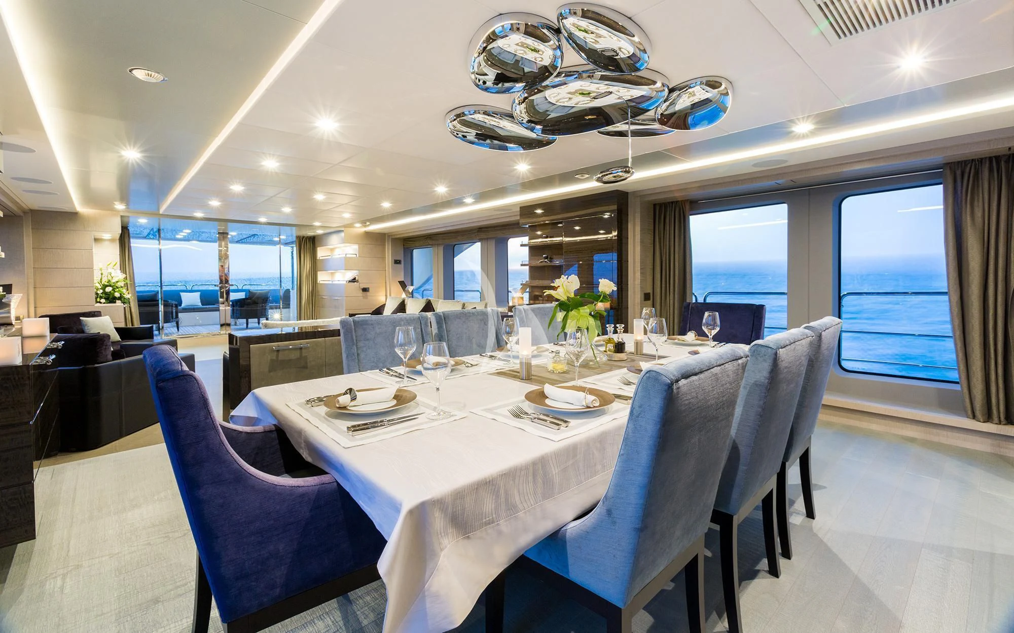 a large dining room with a large table and chairs aboard EDESIA Yacht for Sale