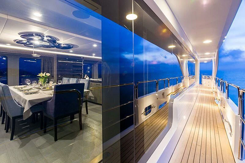 a room with a table and chairs aboard EDESIA Yacht for Sale
