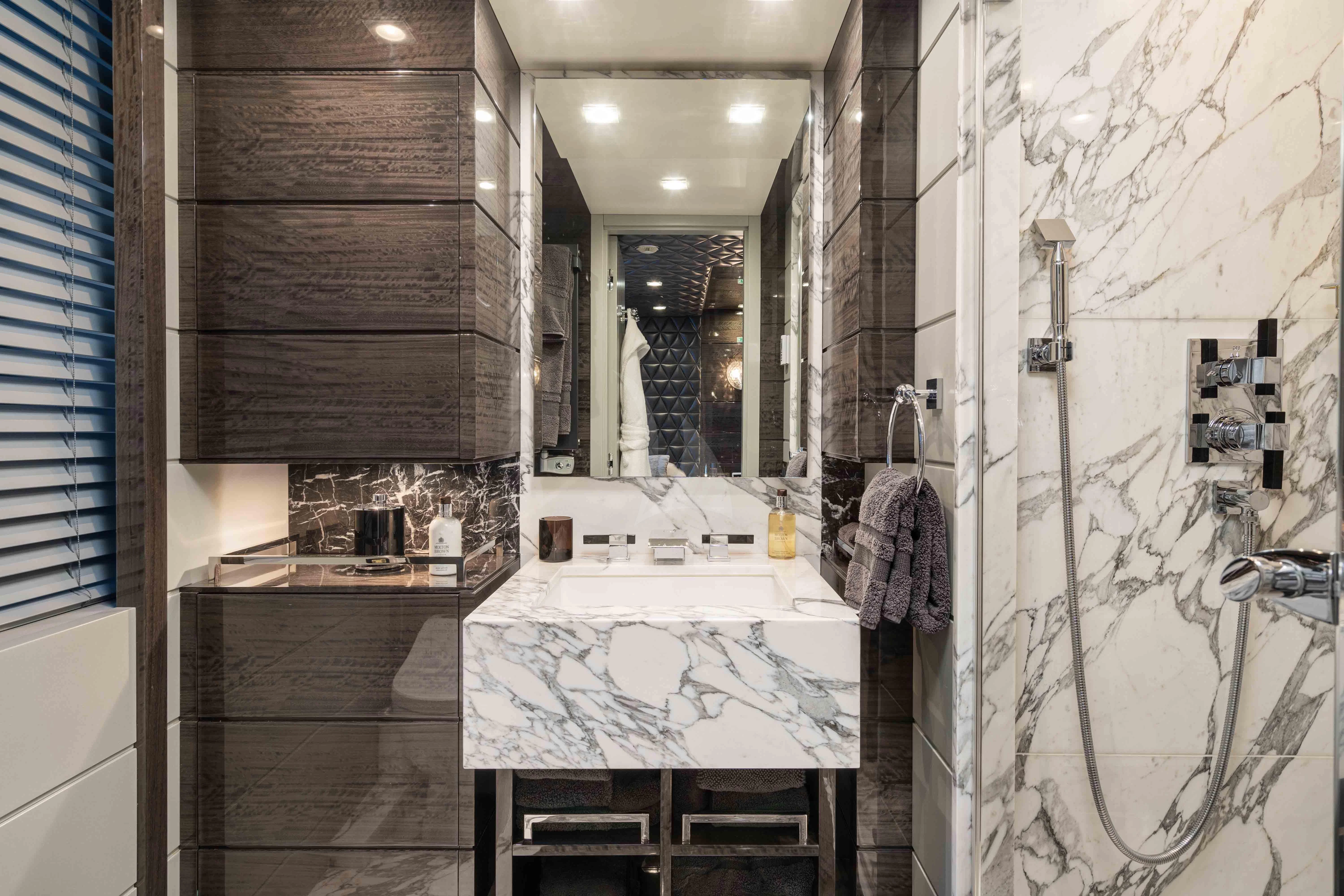 a bathroom with a large mirror aboard EDESIA Yacht for Sale