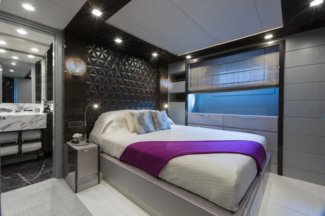 a bedroom with a large bed aboard EDESIA Yacht for Sale