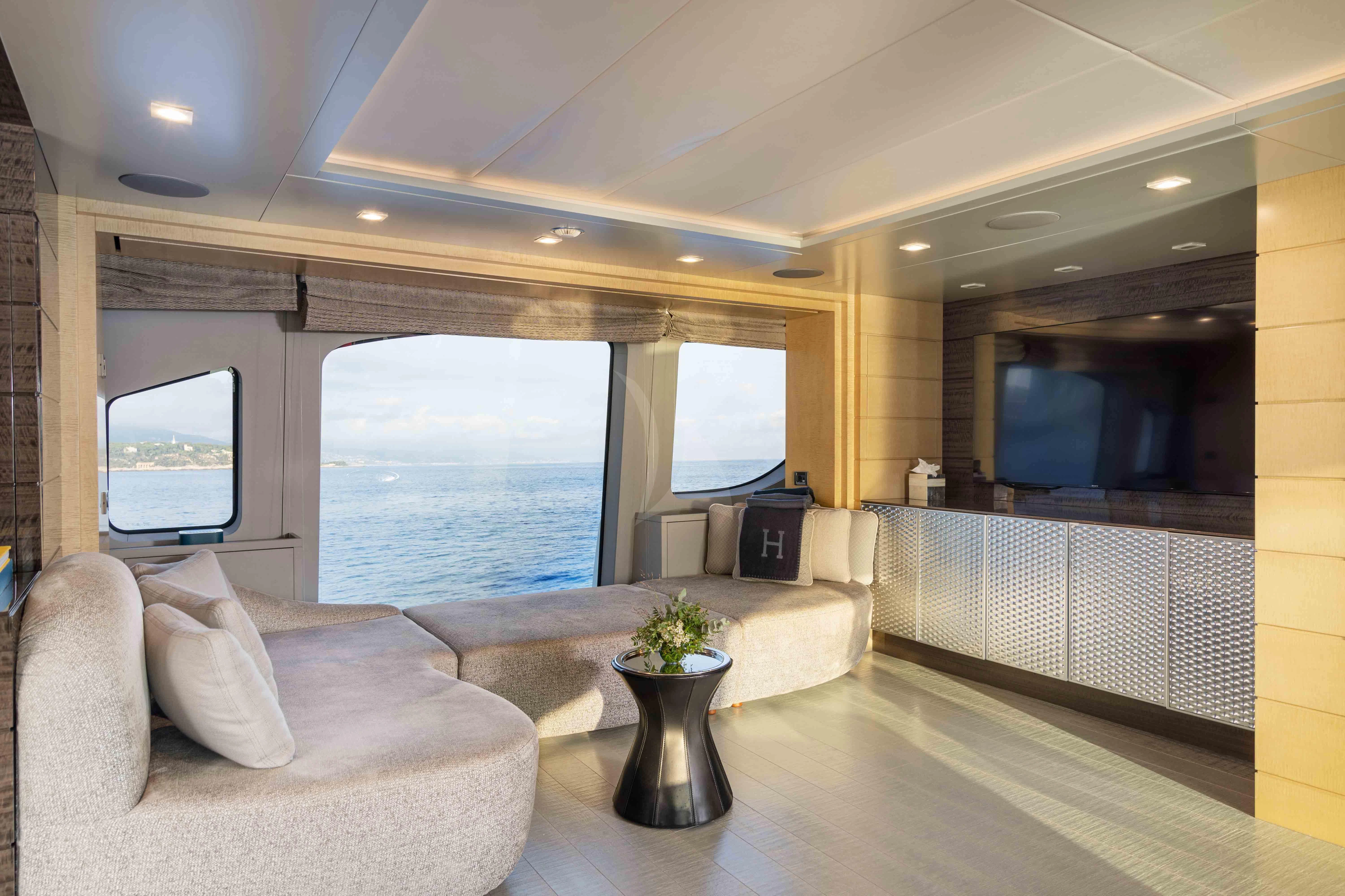 a living room with a large window aboard EDESIA Yacht for Sale
