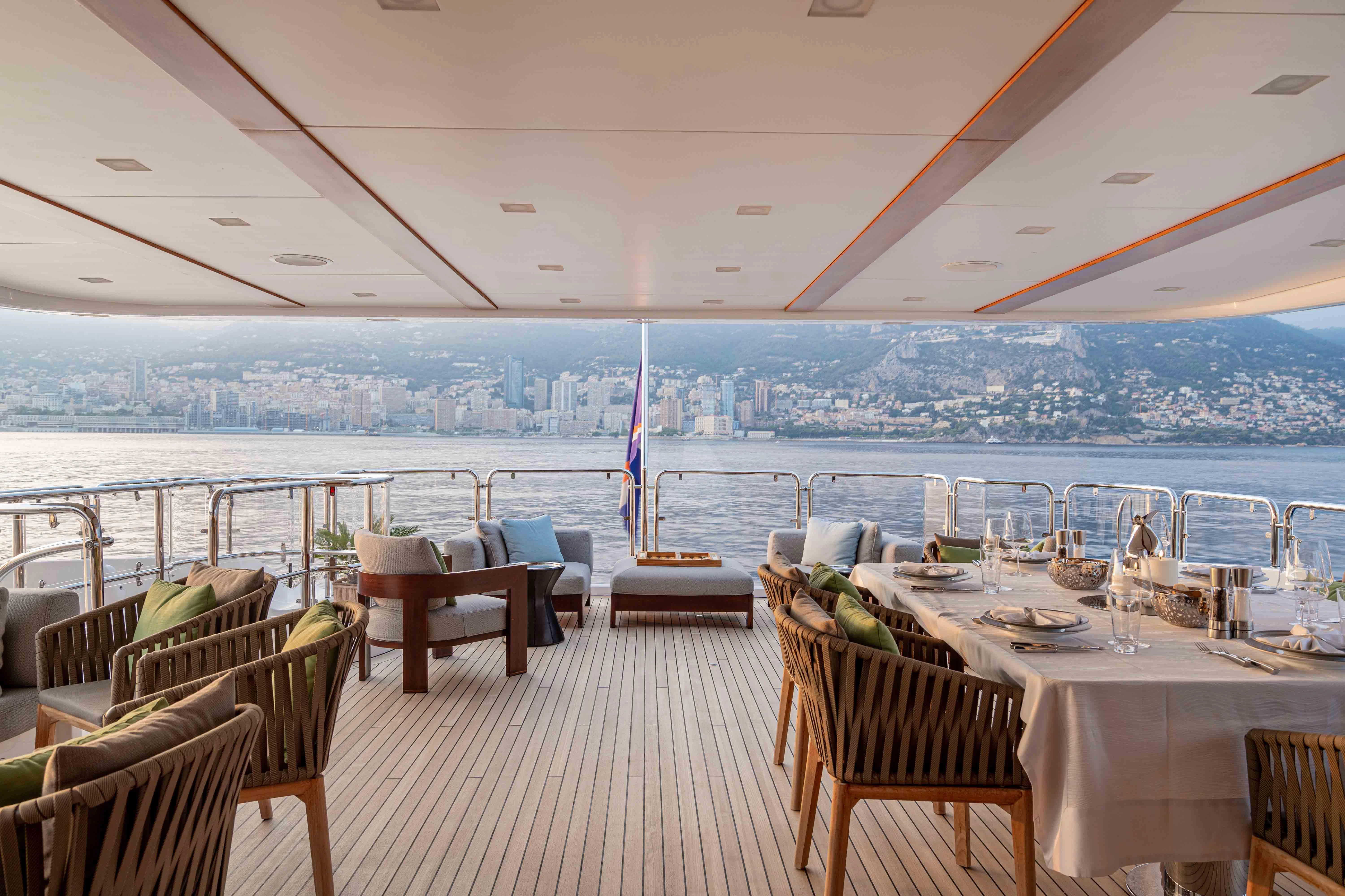 a room with a table and chairs aboard EDESIA Yacht for Sale