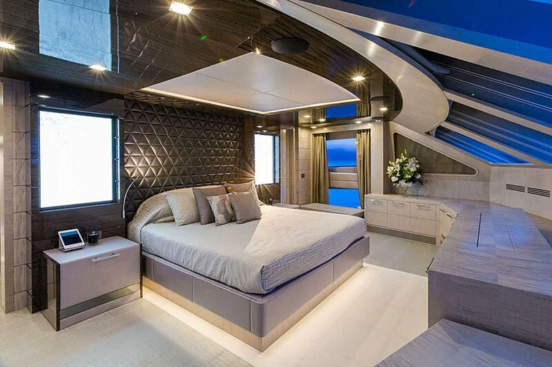 a room with a bed and a window aboard EDESIA Yacht for Sale