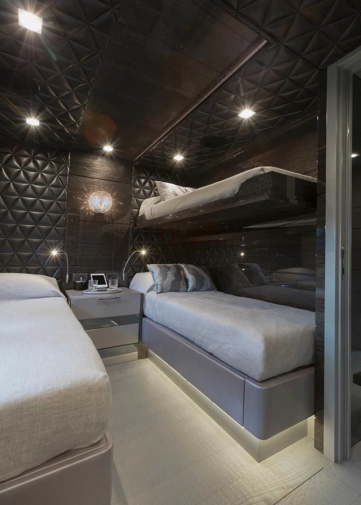 a room with a bed and a couch aboard EDESIA Yacht for Sale