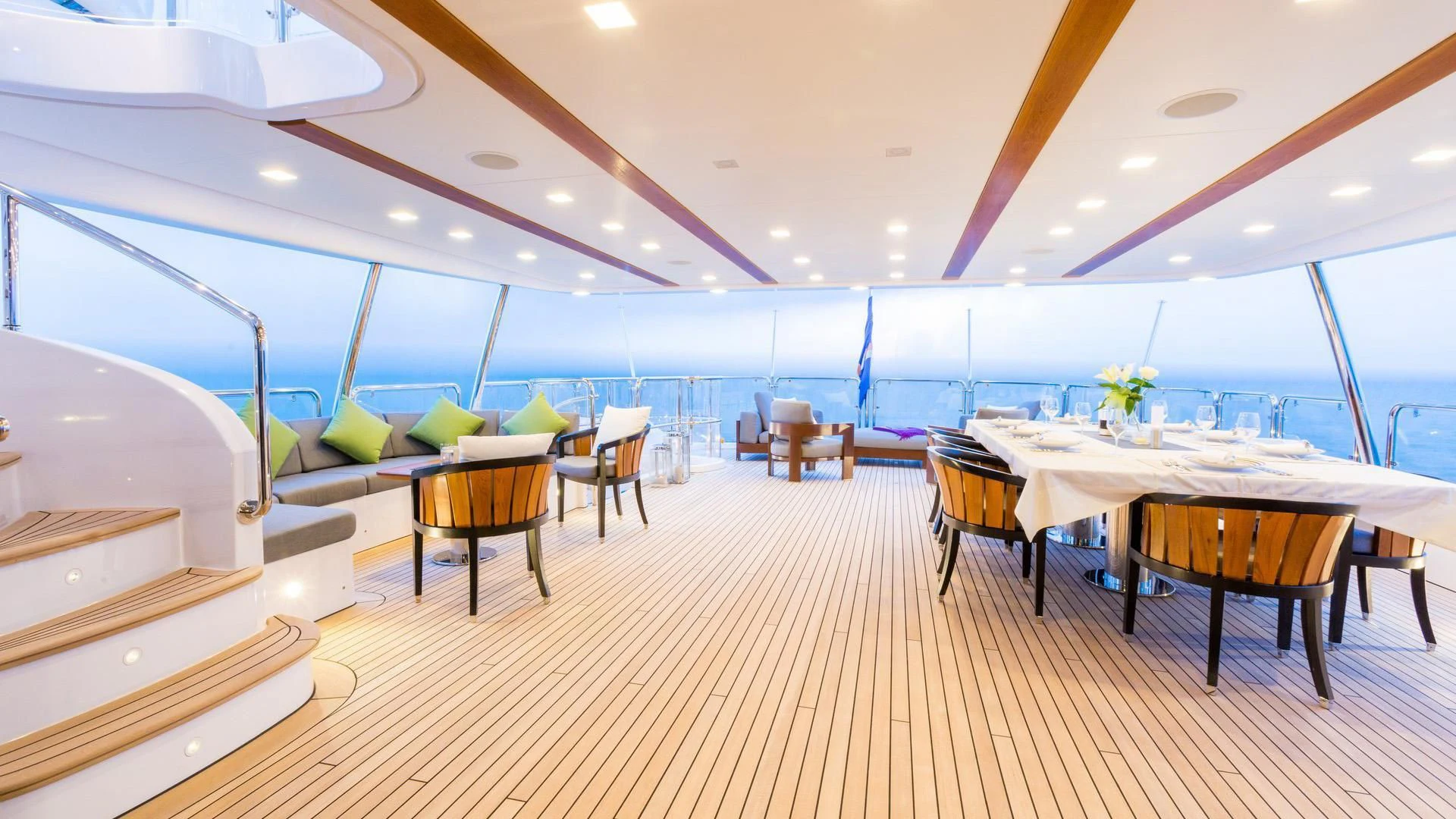 a room with tables and chairs aboard EDESIA Yacht for Sale