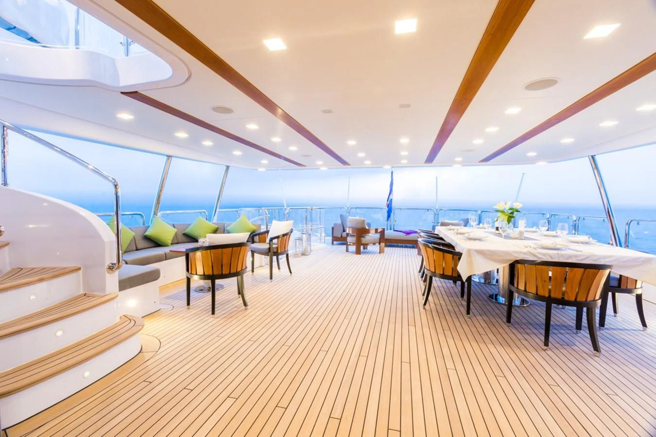 a room with tables and chairs aboard EDESIA Yacht for Sale