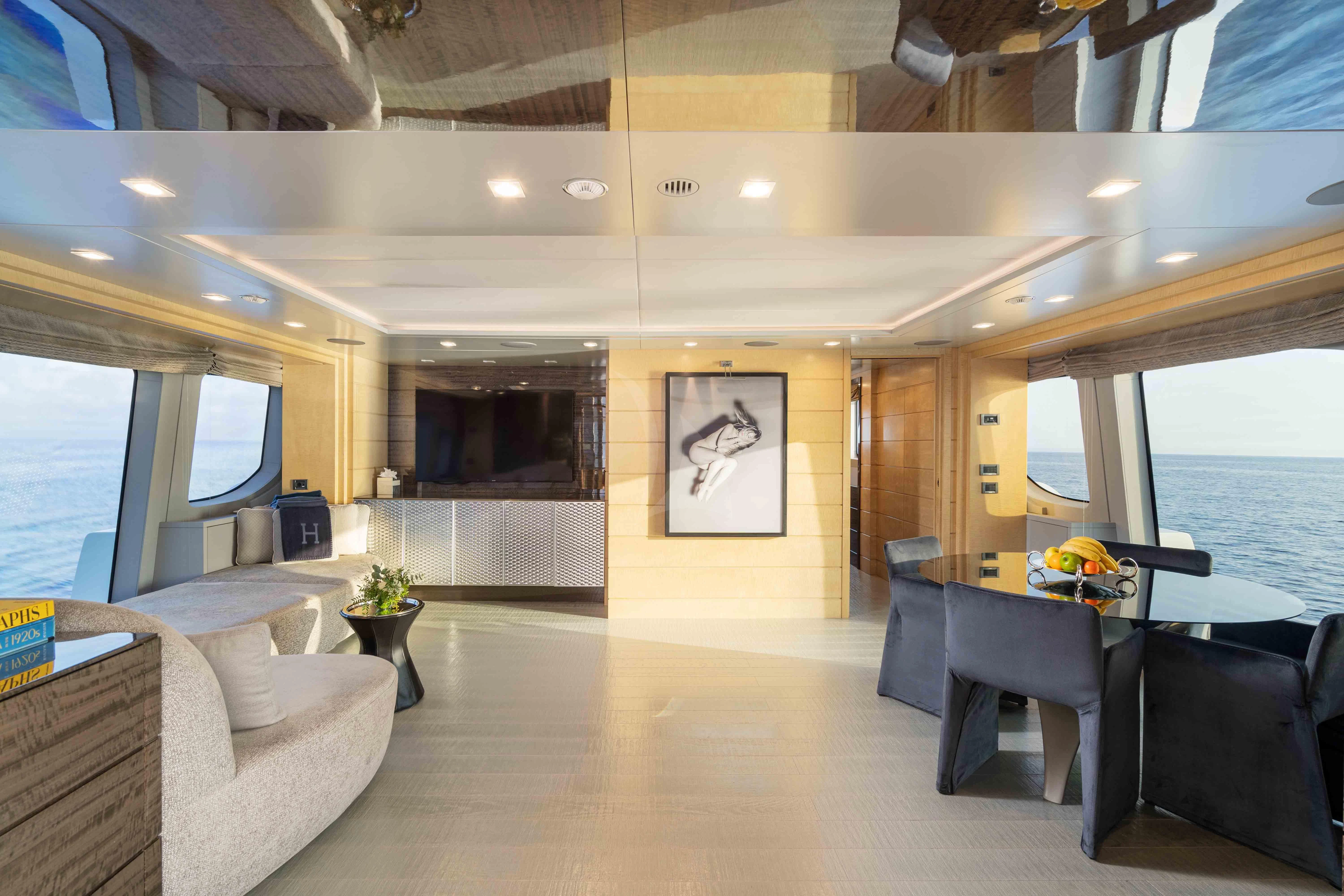 a living room with a large window aboard EDESIA Yacht for Sale