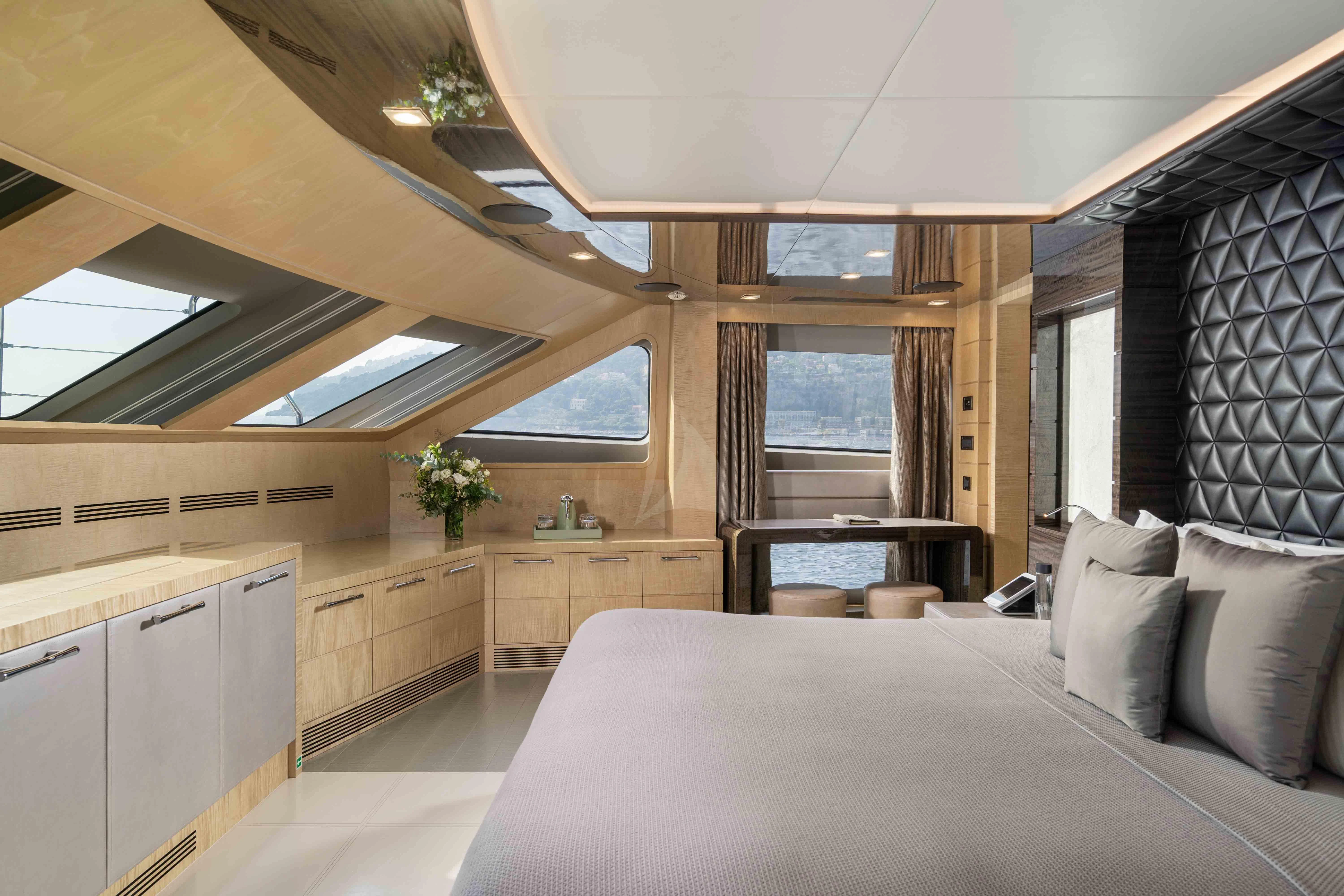 a bedroom with a large bed aboard EDESIA Yacht for Sale