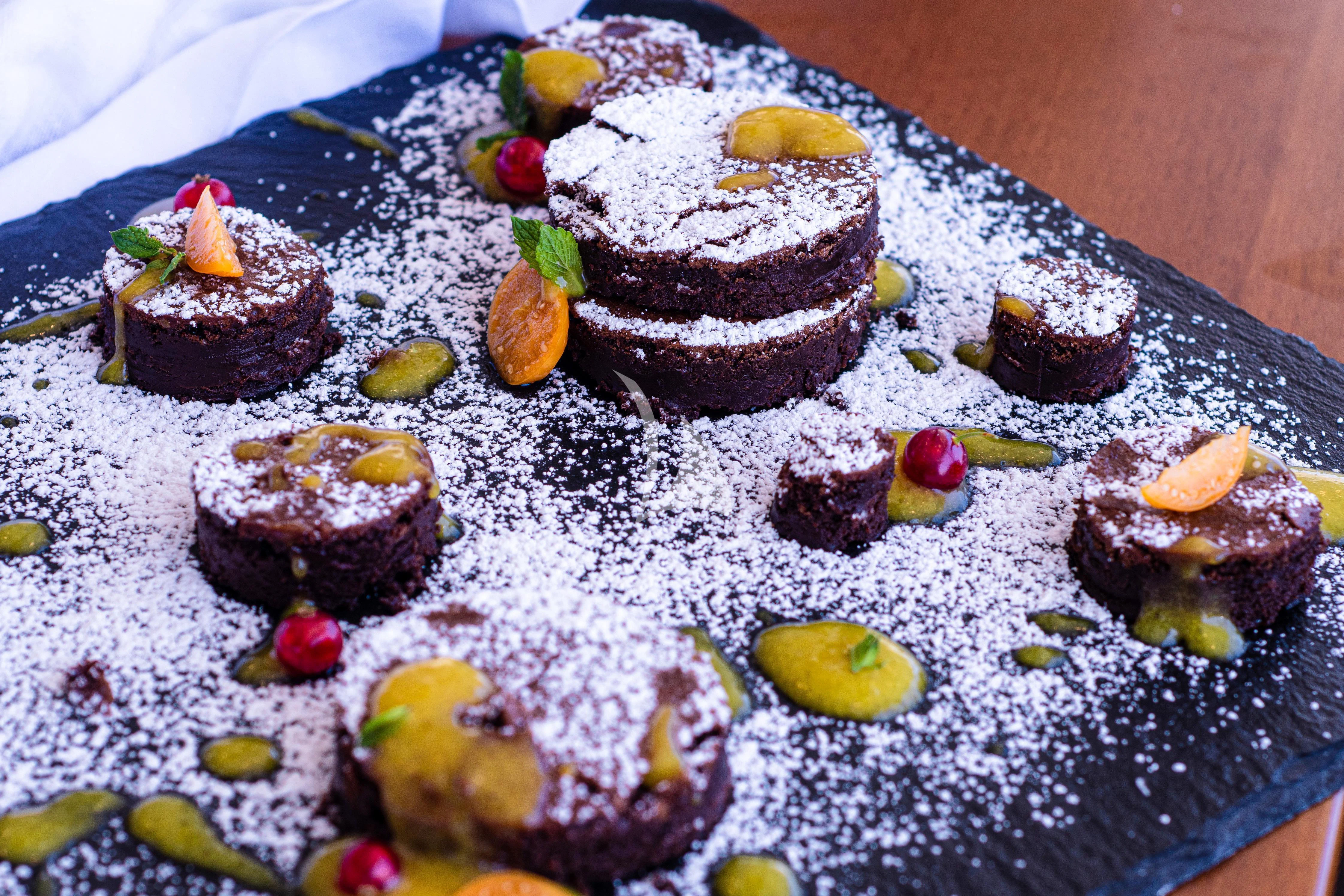 a plate of desserts aboard EDESIA Yacht for Sale