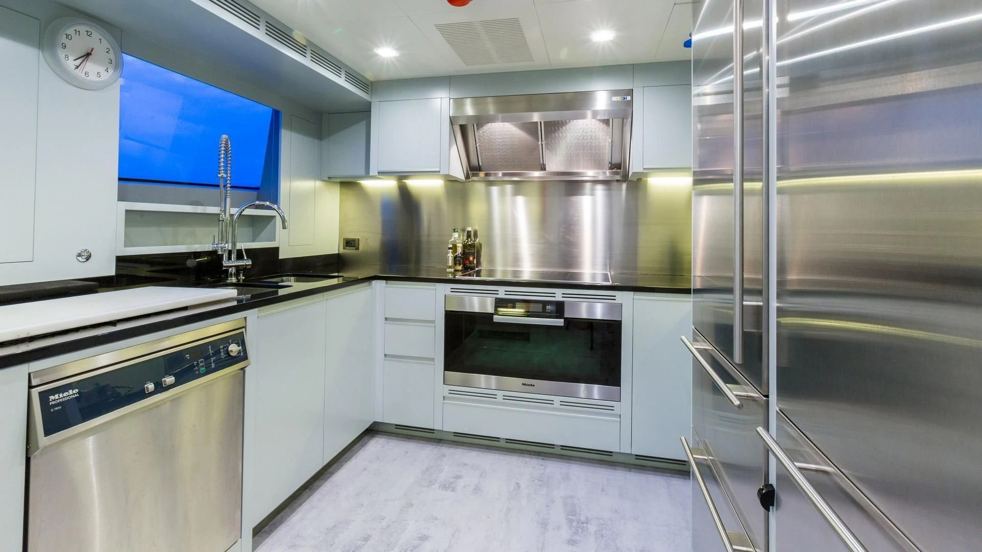 a kitchen with a stainless steel oven aboard EDESIA Yacht for Sale