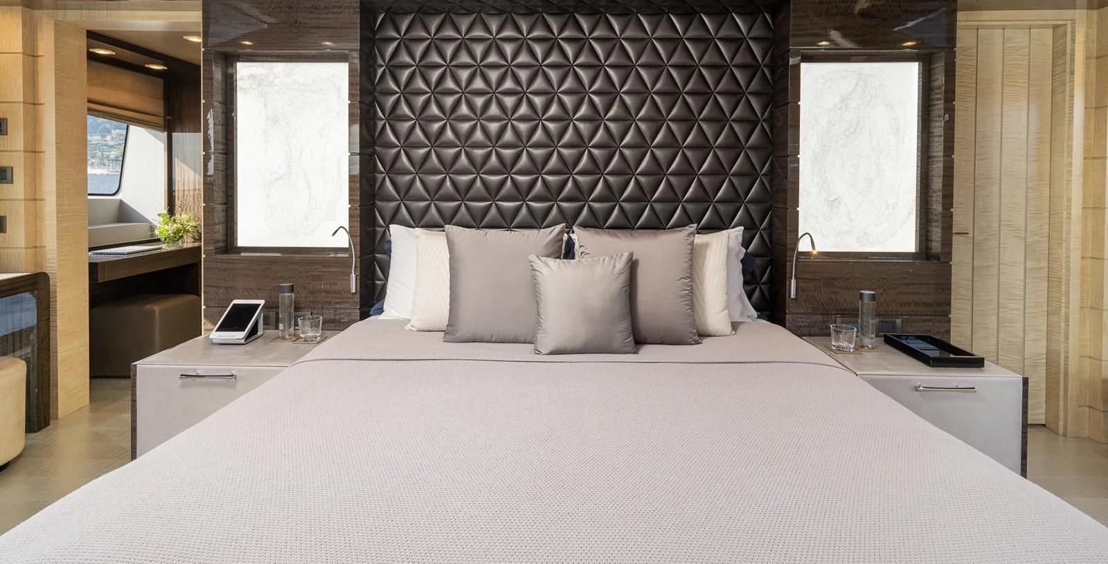 a bed with white sheets aboard EDESIA Yacht for Sale