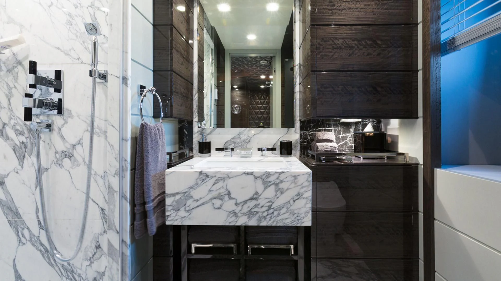 a bathroom with a large marble counter aboard EDESIA Yacht for Sale