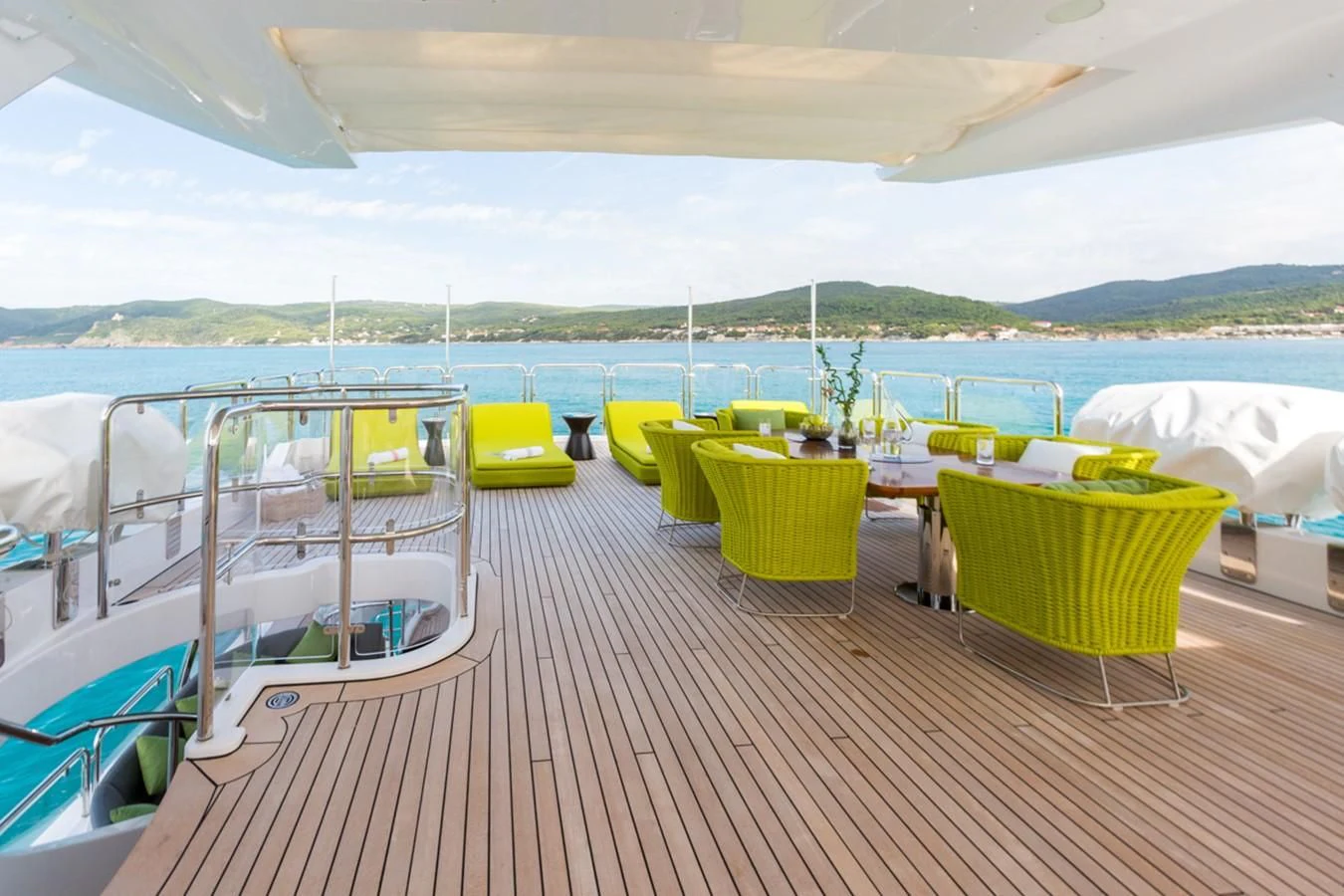 a deck with chairs and tables on it aboard EDESIA Yacht for Sale