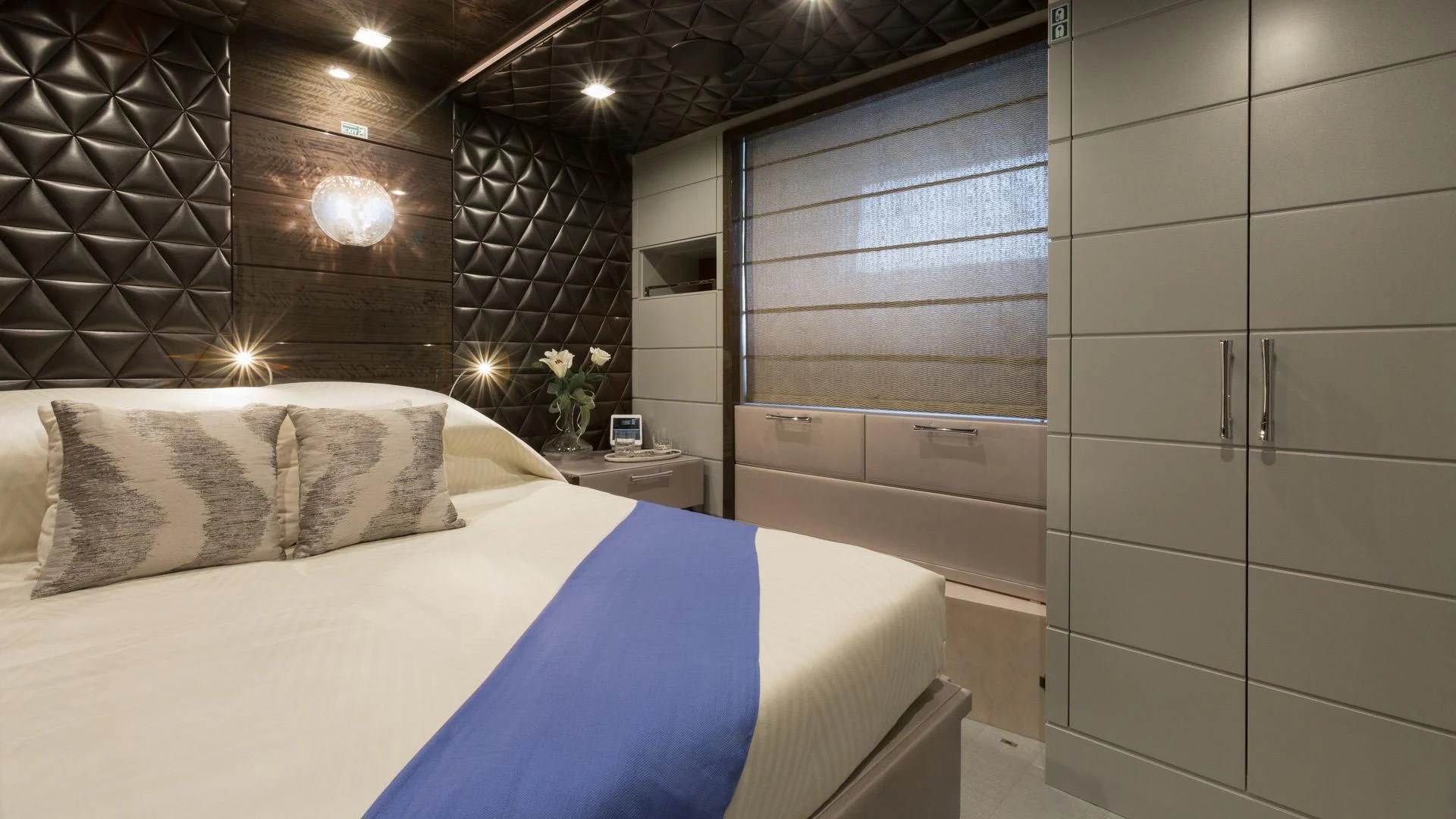 a room with a bed and a window aboard EDESIA Yacht for Sale