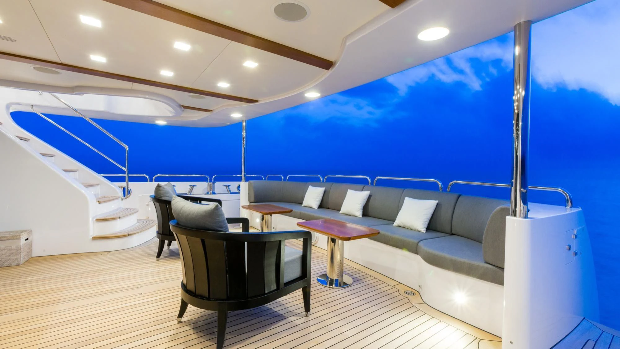 a room with a couch and a table and chairs aboard EDESIA Yacht for Sale