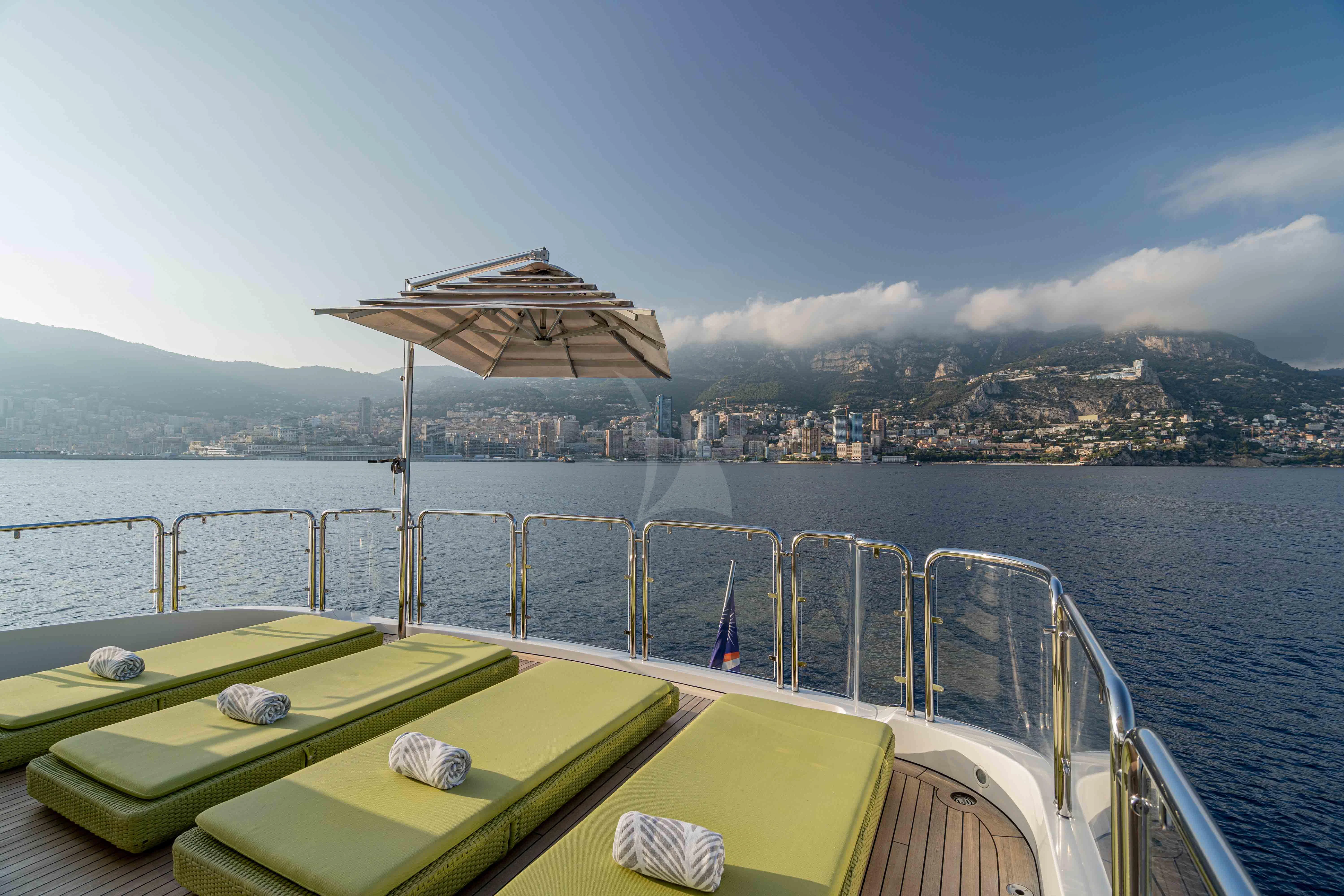 a boat with a umbrella on it aboard EDESIA Yacht for Sale