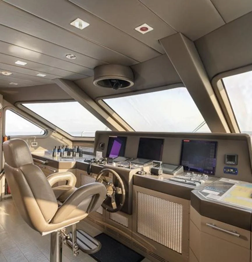 a room with computers and chairs aboard EDESIA Yacht for Sale