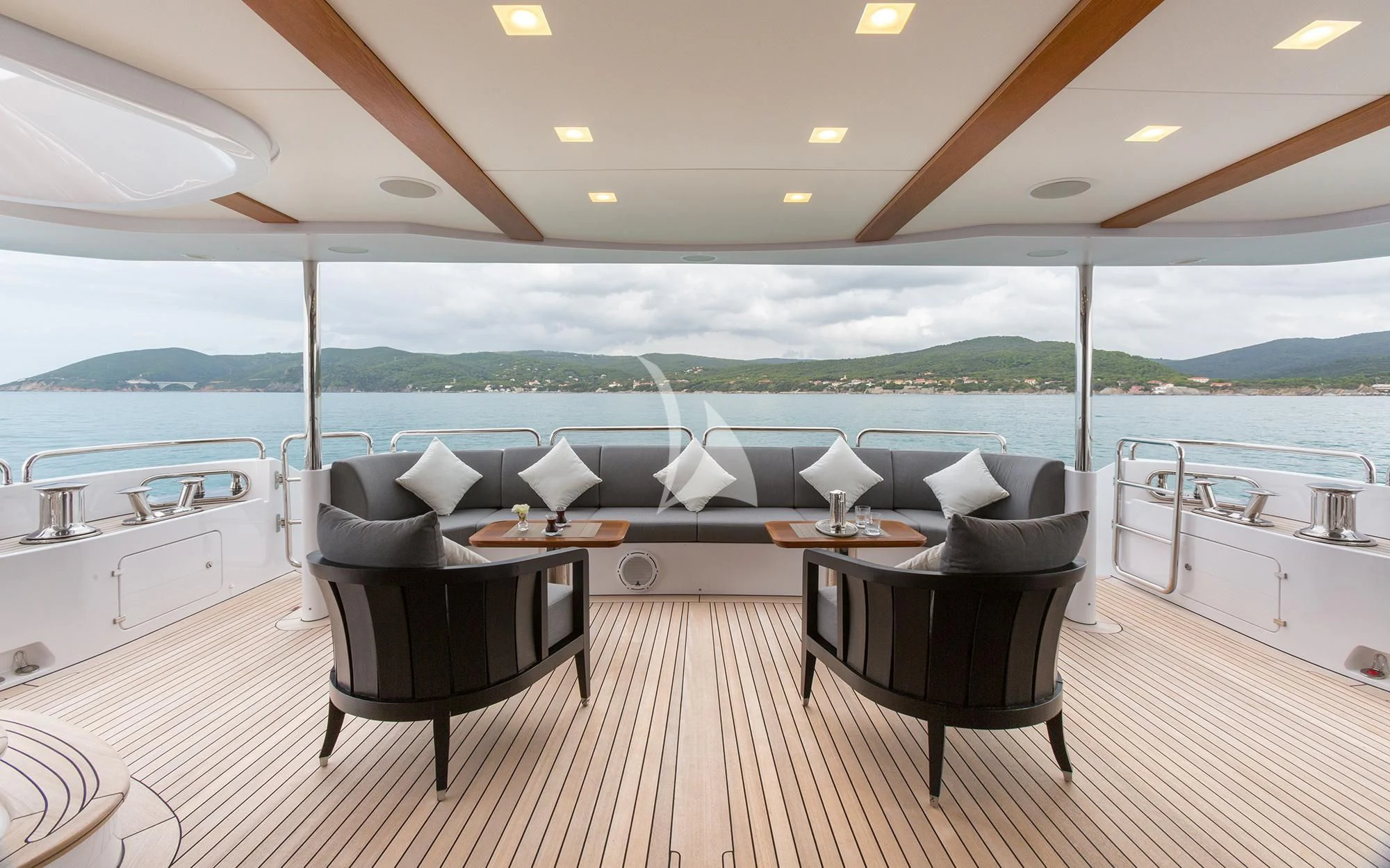 a table and chairs on a deck aboard EDESIA Yacht for Sale