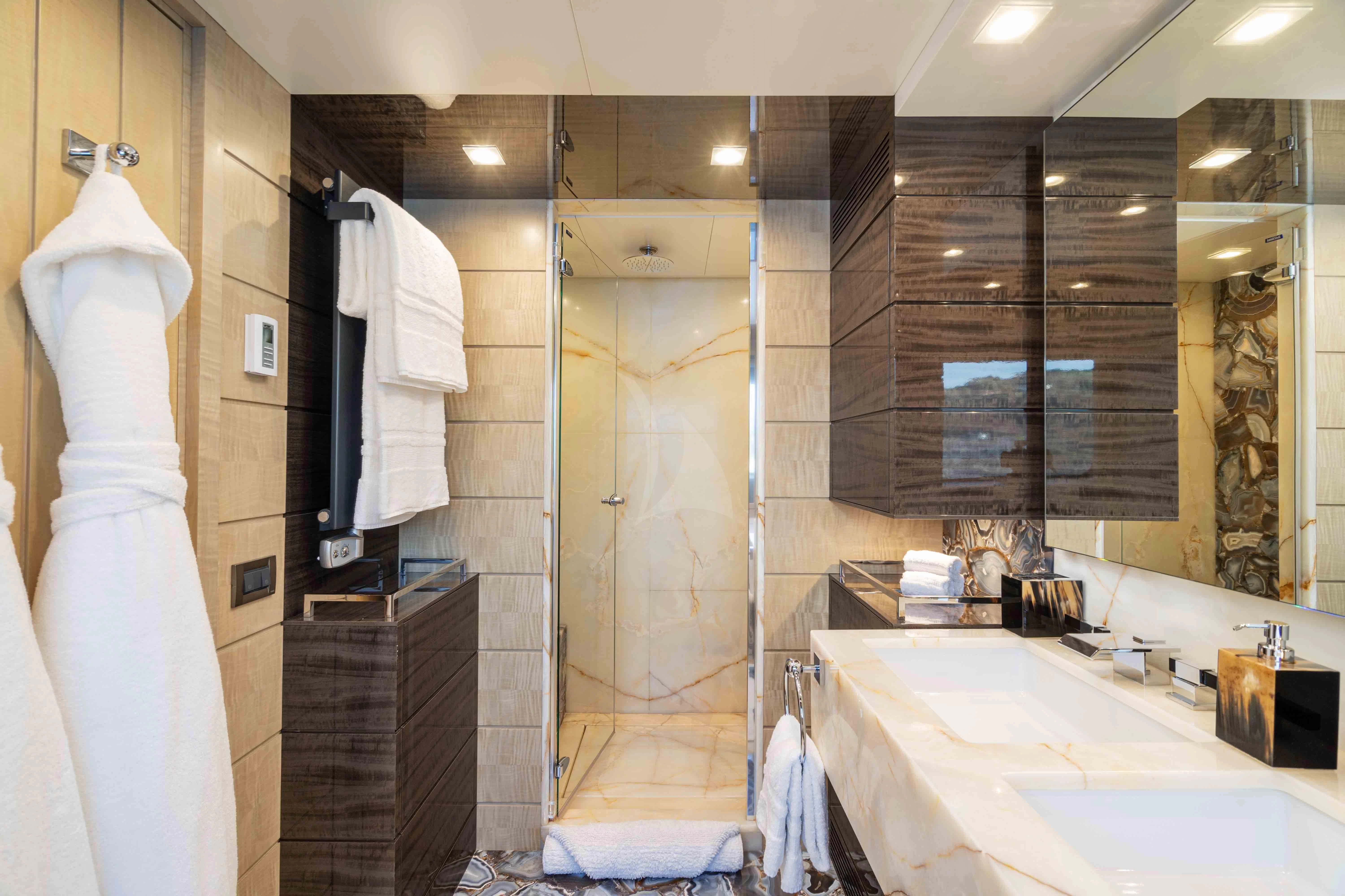 a bathroom with a shower and sink aboard EDESIA Yacht for Sale