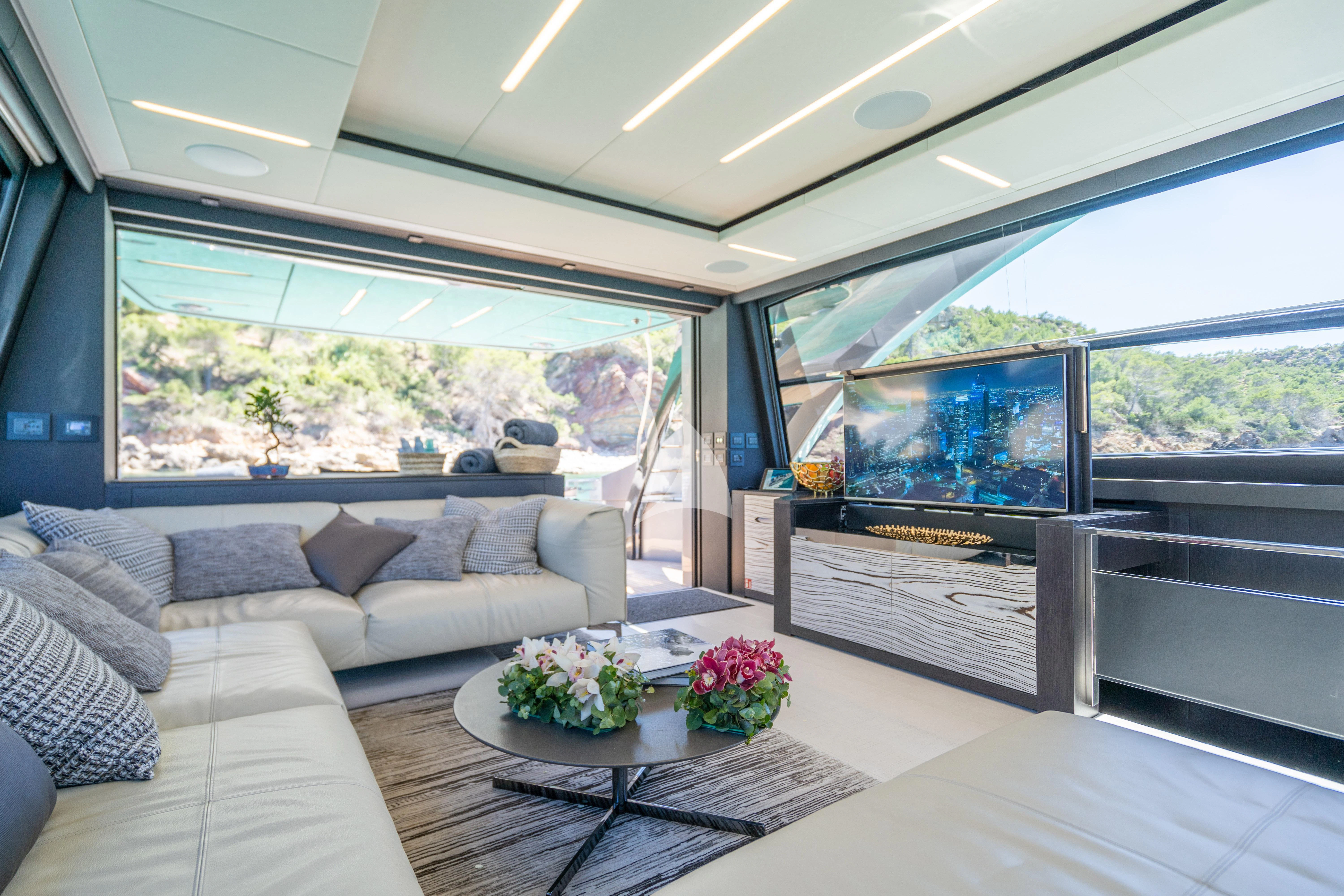 a living room with a large window aboard BEYOND Yacht for Sale
