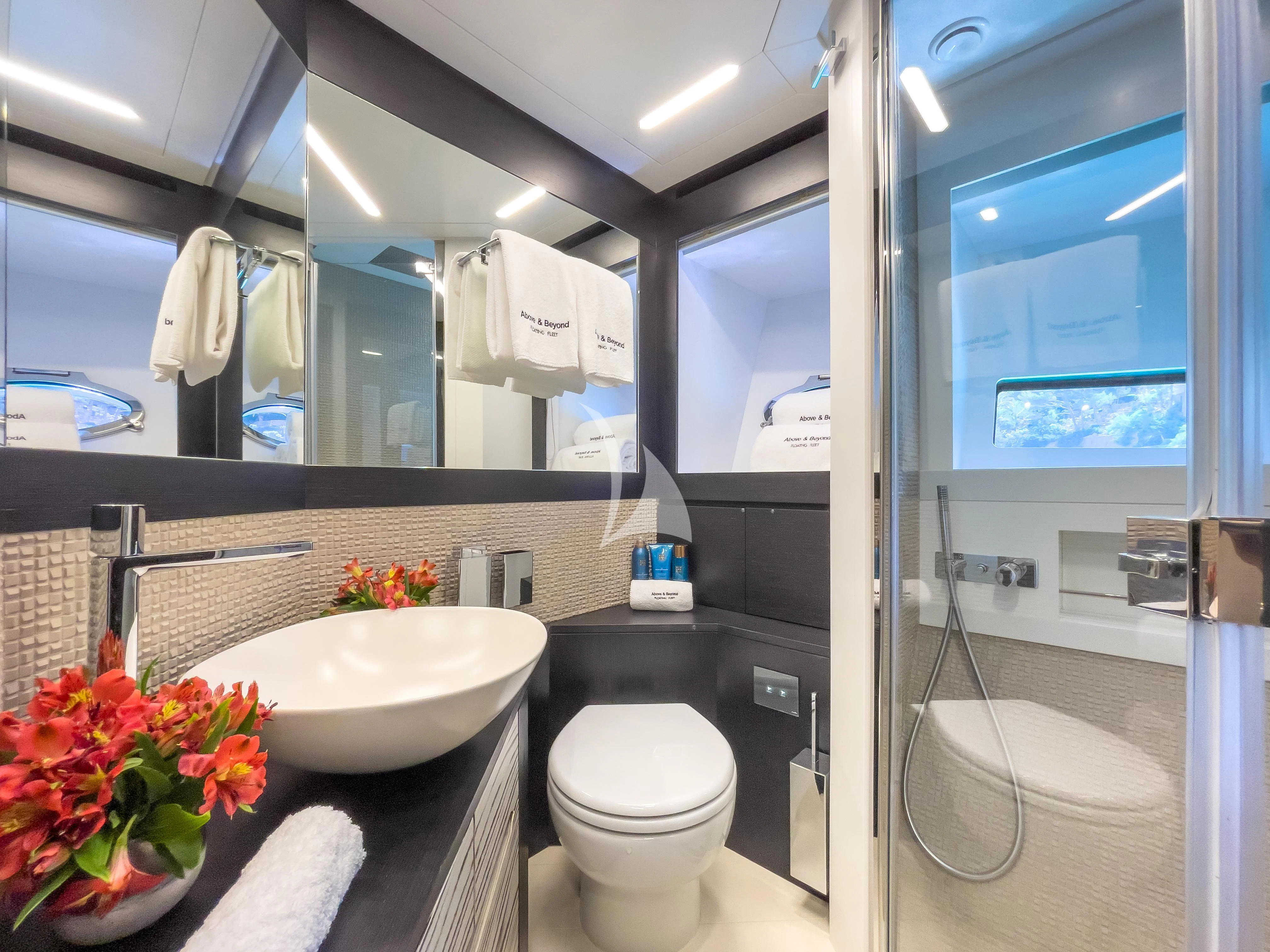 a bathroom with a large mirror aboard BEYOND Yacht for Sale