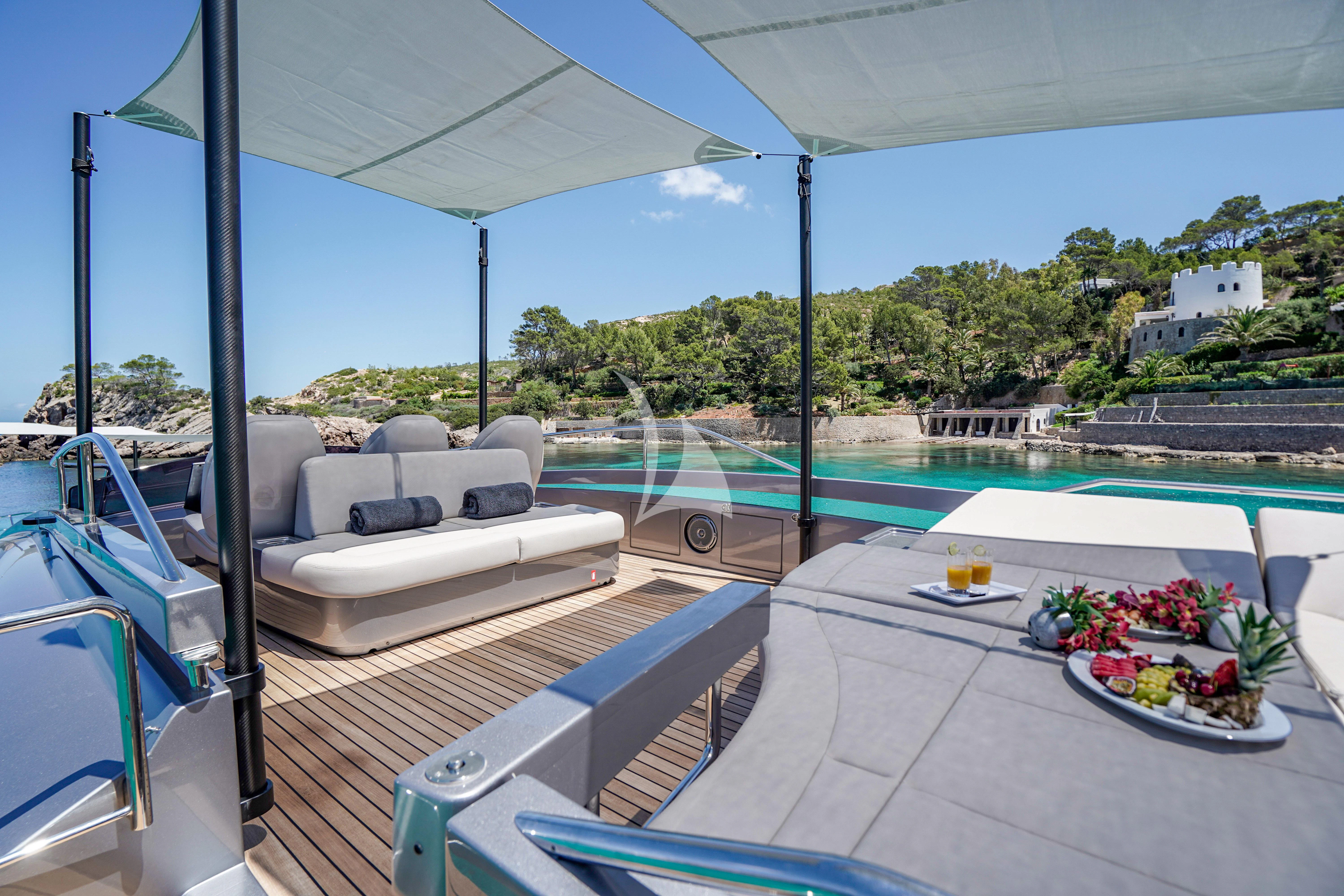 a patio with a table and chairs aboard BEYOND Yacht for Sale