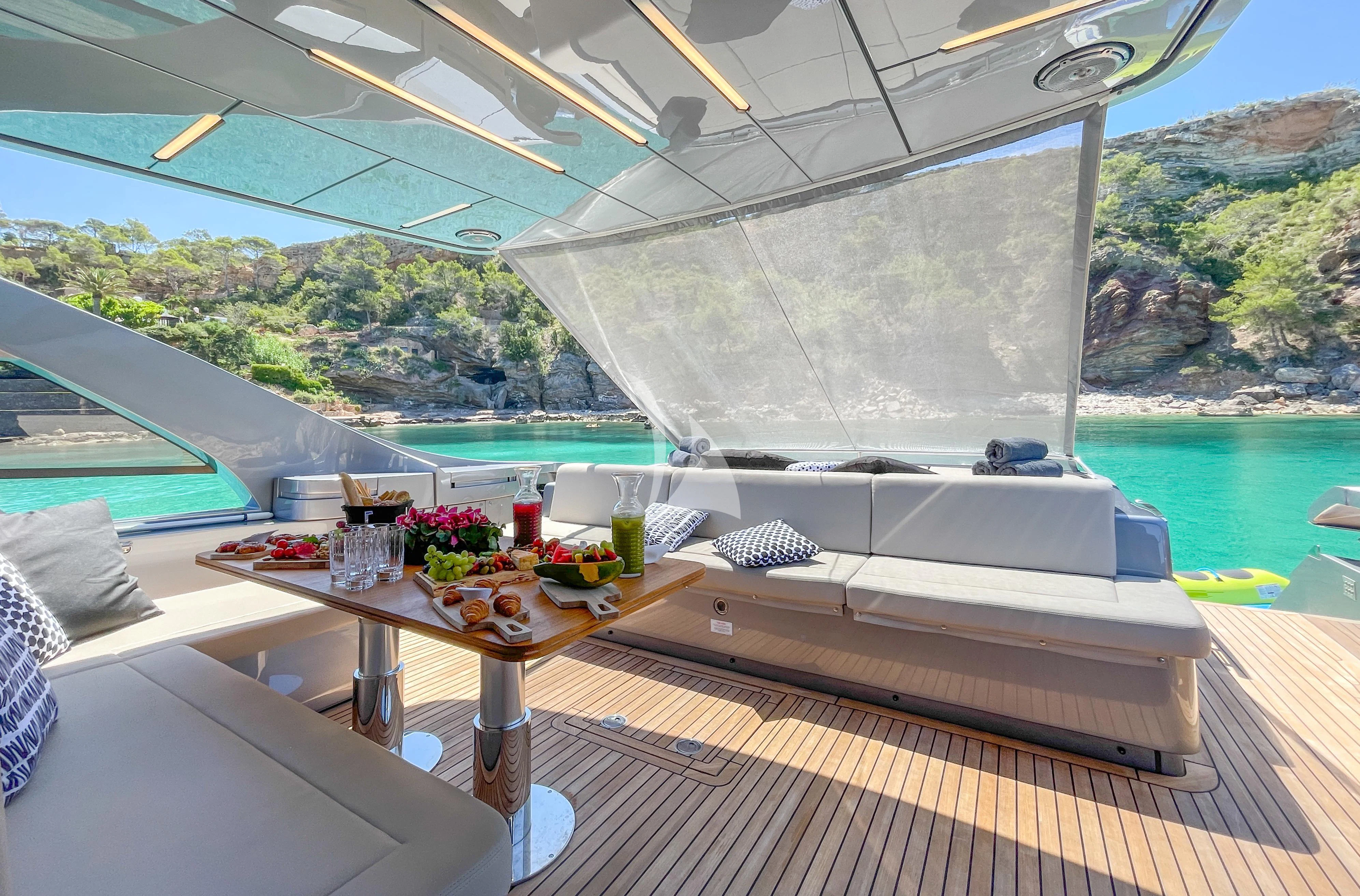 a room with a table and chairs aboard BEYOND Yacht for Sale