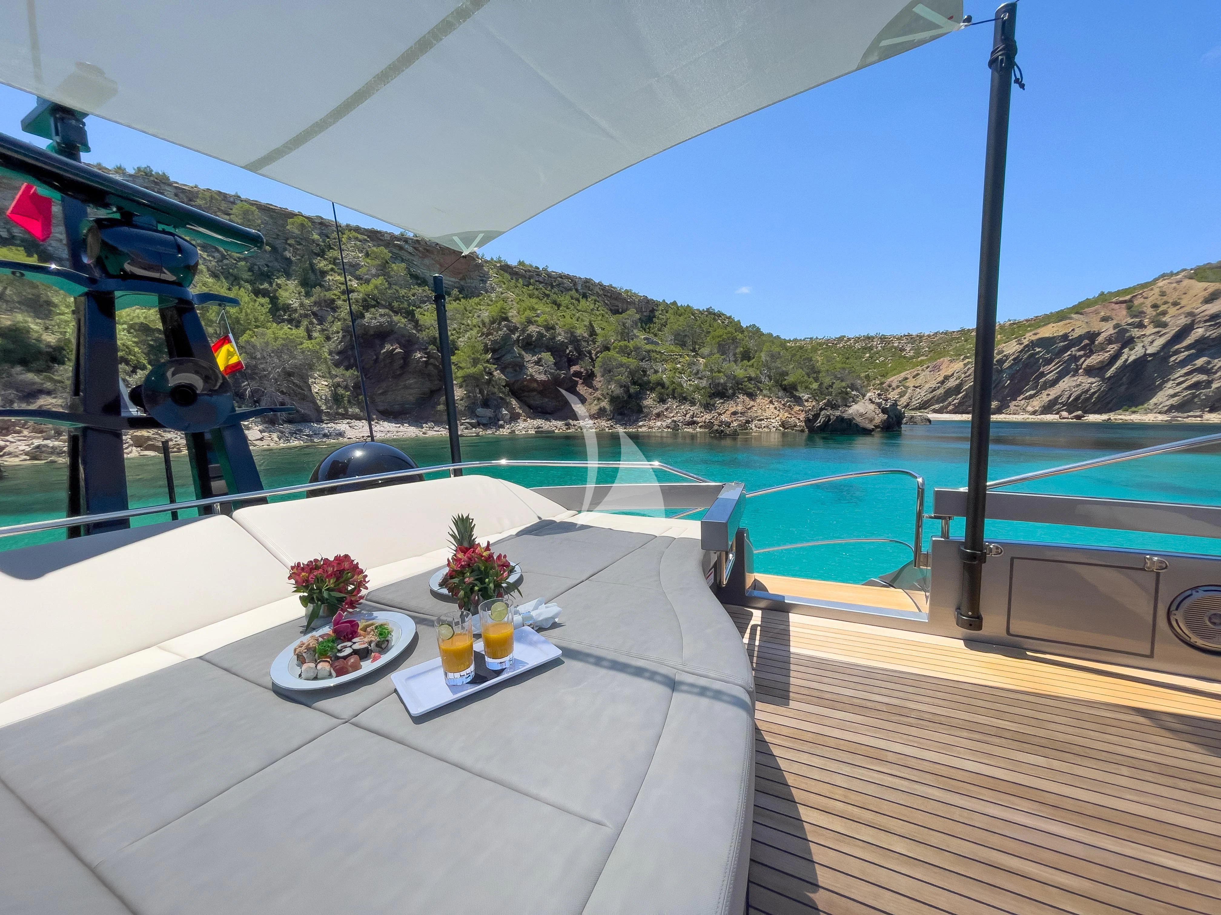 a pool with a table and chairs aboard BEYOND Yacht for Sale