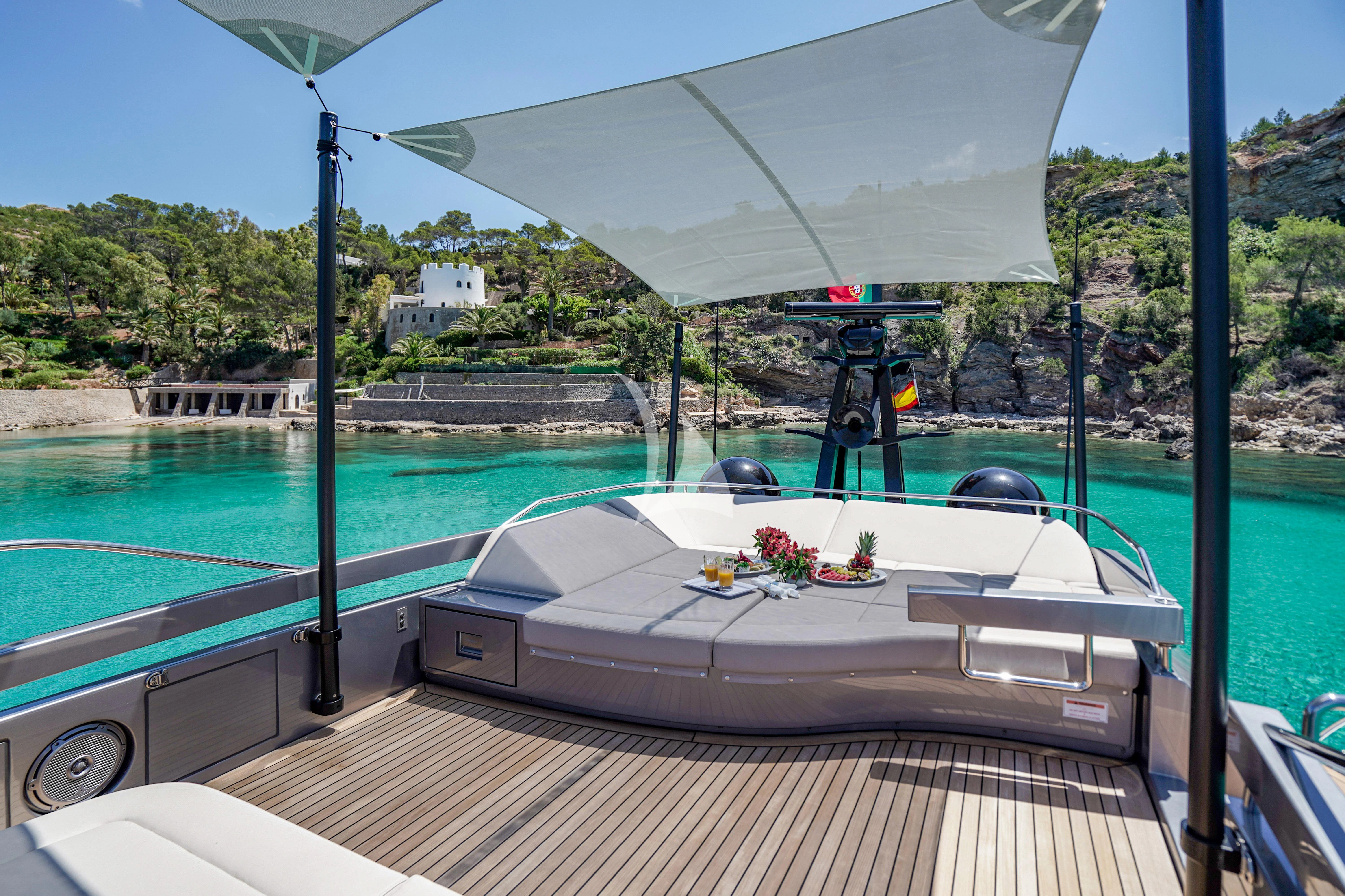 a table on a deck aboard BEYOND Yacht for Sale