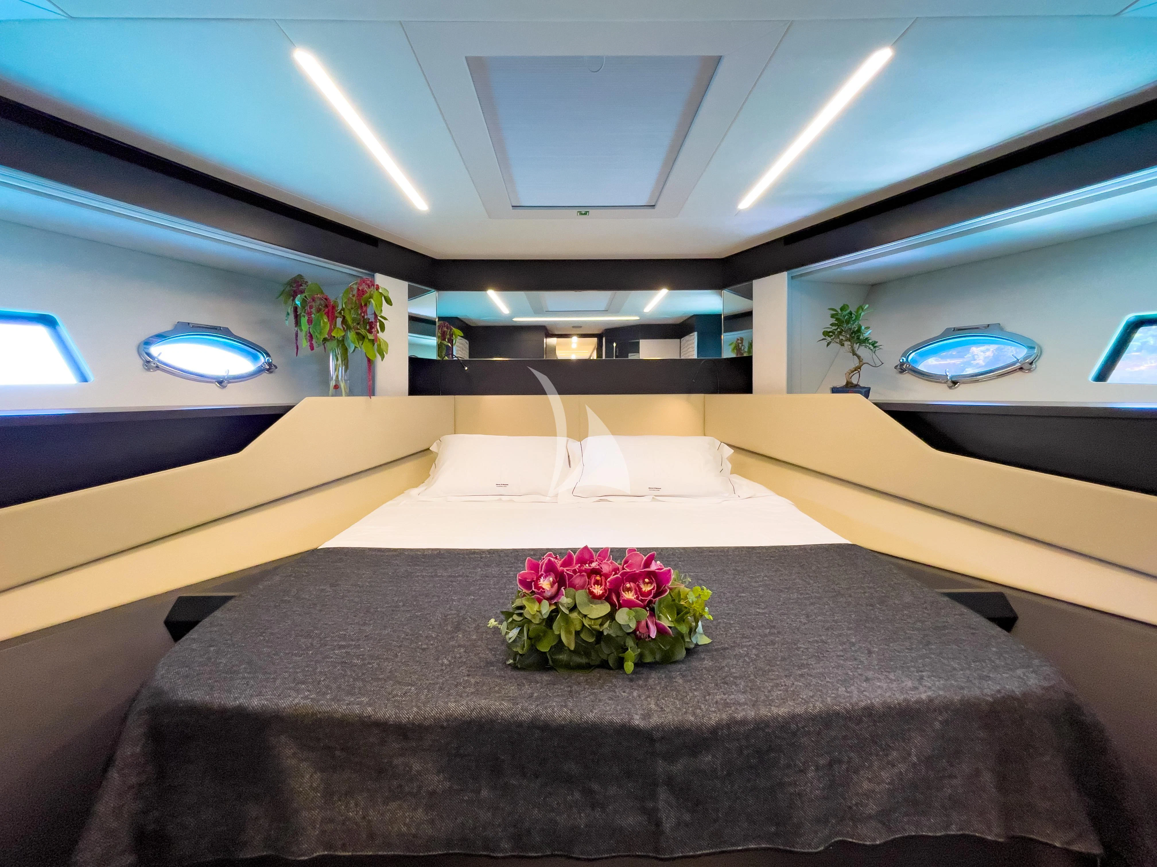 a room with a table and chairs aboard BEYOND Yacht for Sale