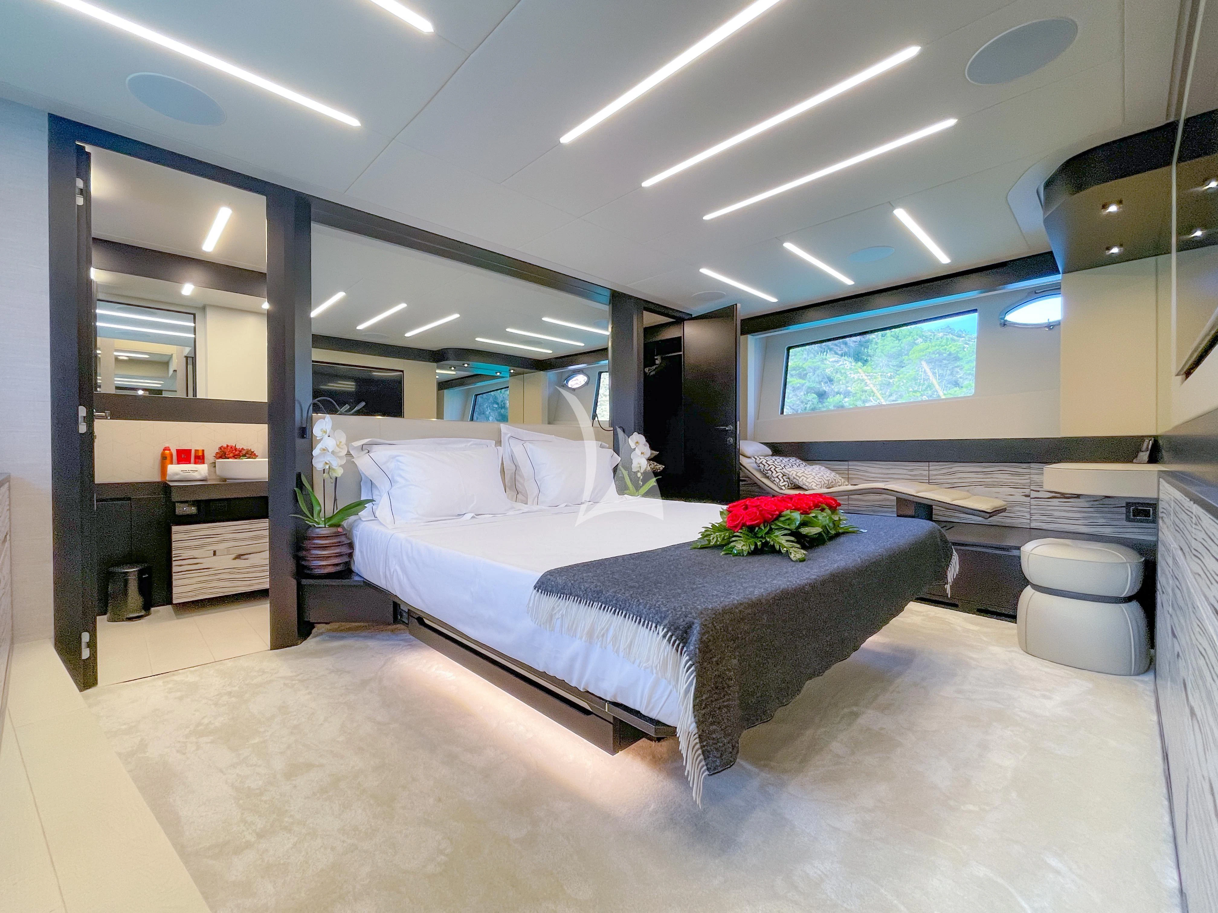 a large bedroom with a large bed aboard BEYOND Yacht for Sale