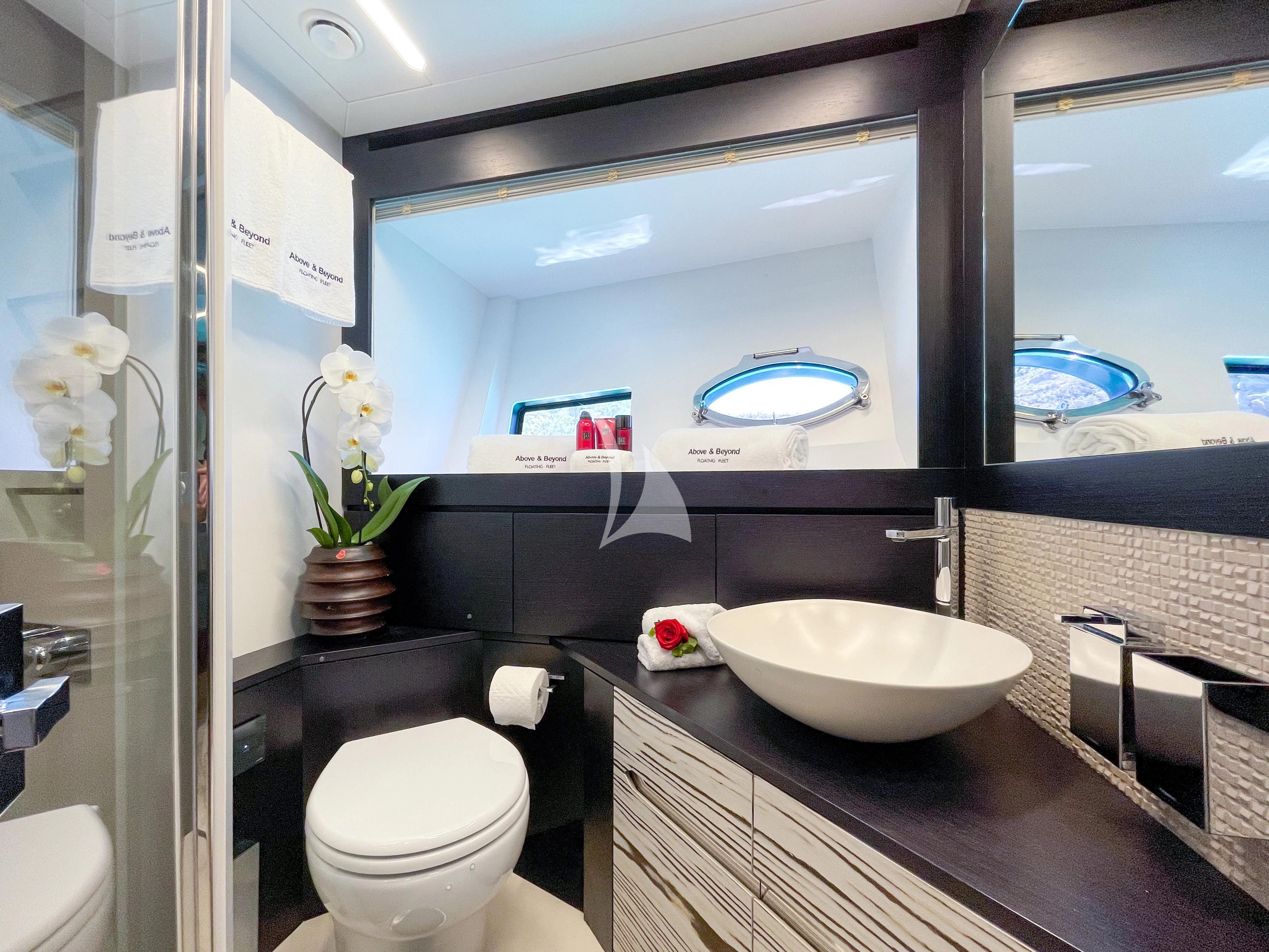 a bathroom with a large mirror aboard BEYOND Yacht for Sale