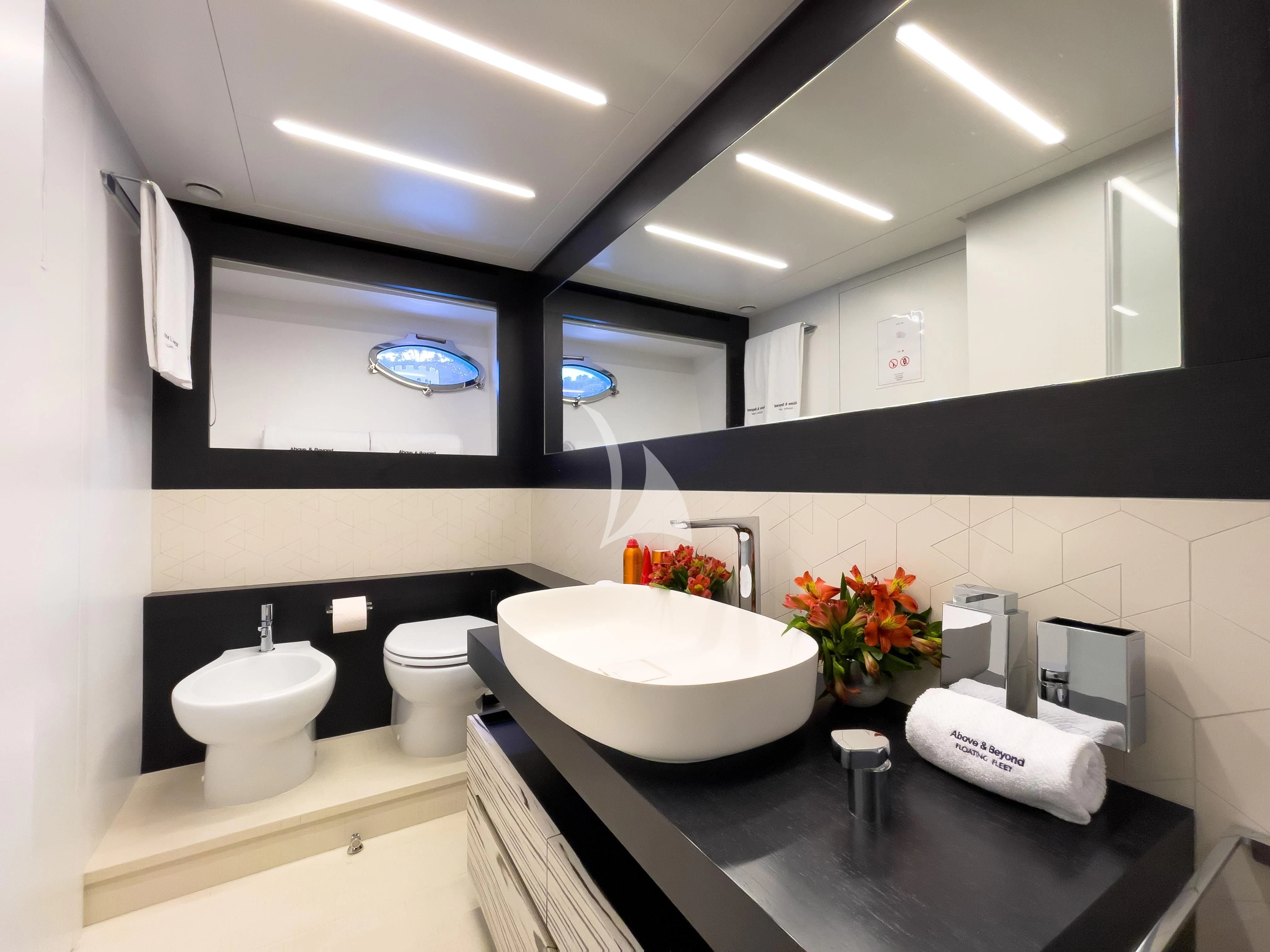 a bathroom with sinks and mirrors aboard BEYOND Yacht for Sale