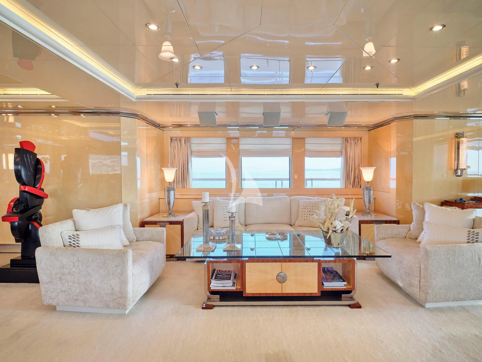 a living room with a large mirror aboard SUNDAY Yacht for Charter