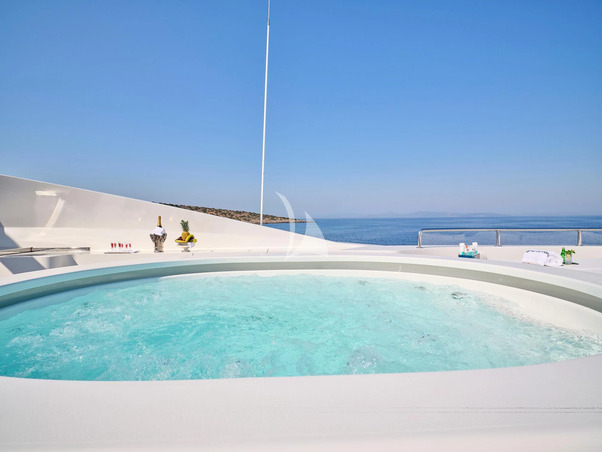a pool with a person in the distance aboard SUNDAY Yacht for Charter