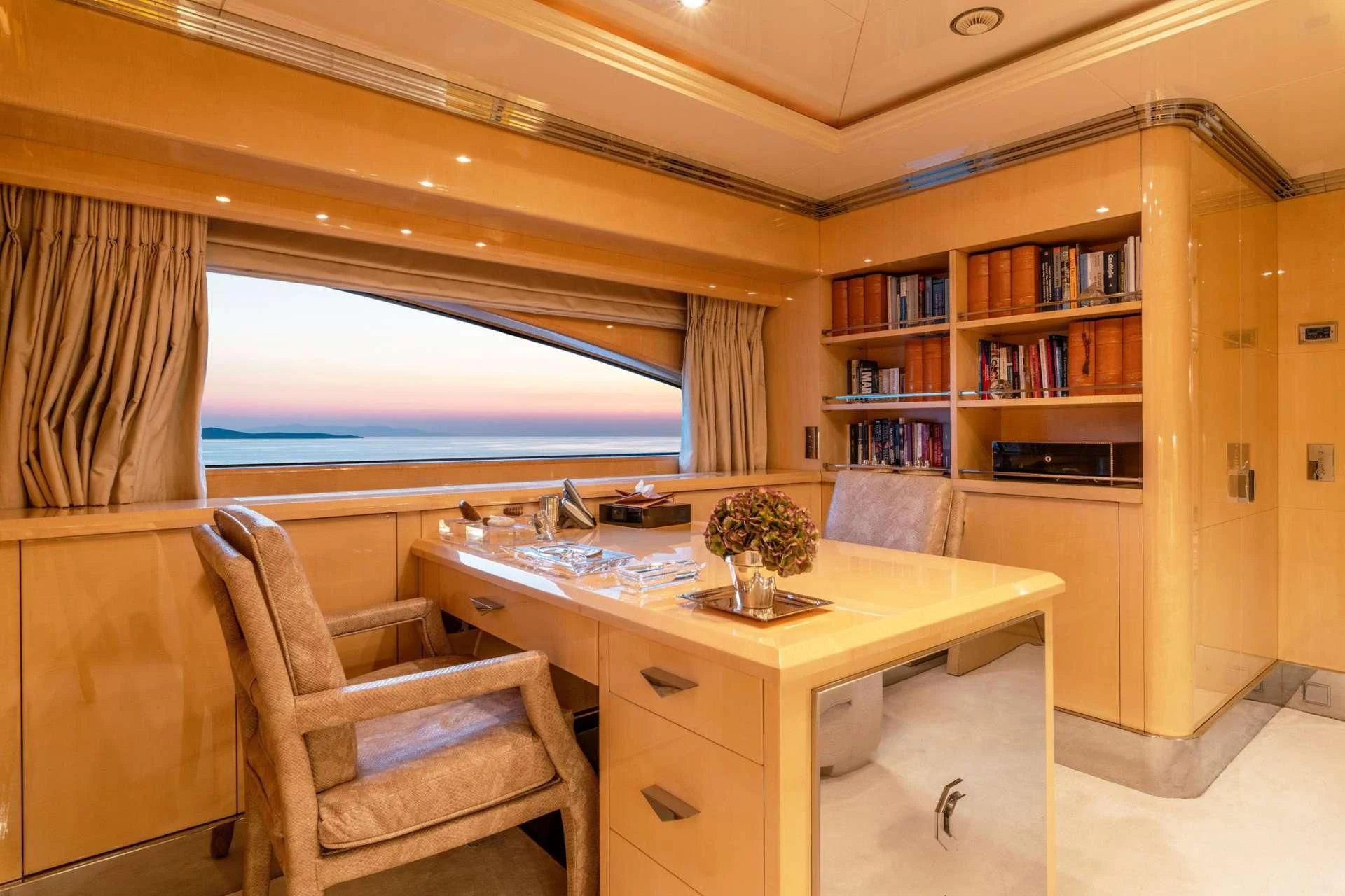 a room with a table and chairs aboard SUNDAY Yacht for Charter