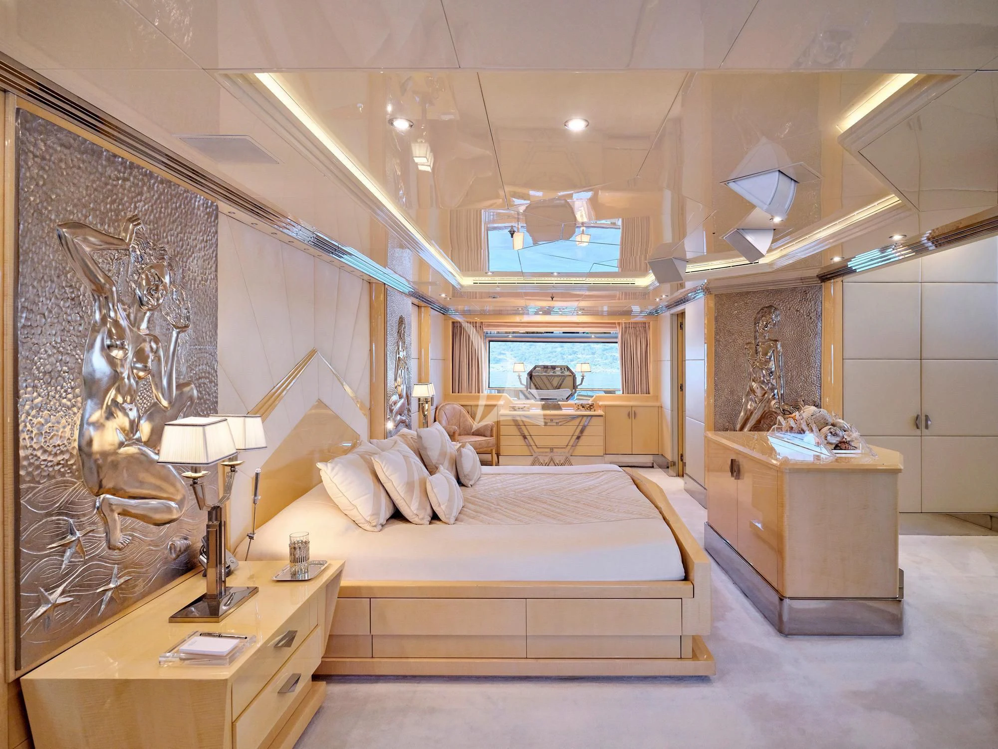a bedroom with a bed and a desk aboard SUNDAY Yacht for Charter
