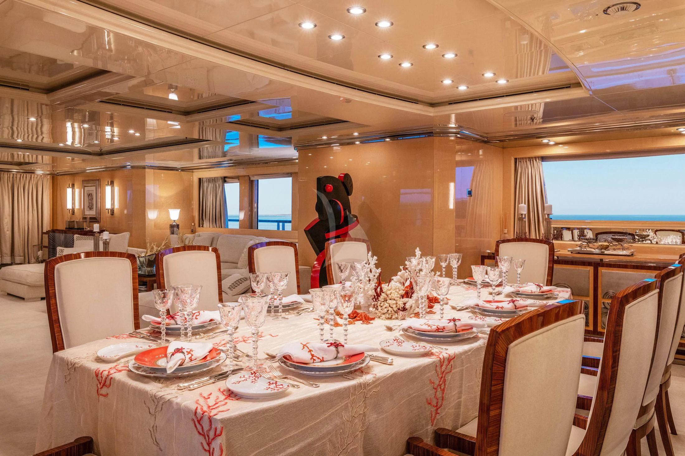 a room with tables and chairs aboard SUNDAY Yacht for Charter
