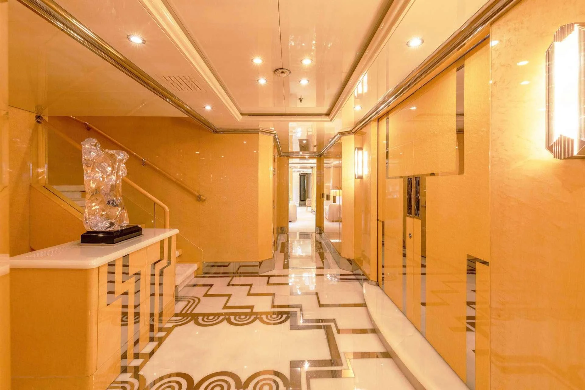 a hallway with a statue aboard SUNDAY Yacht for Charter