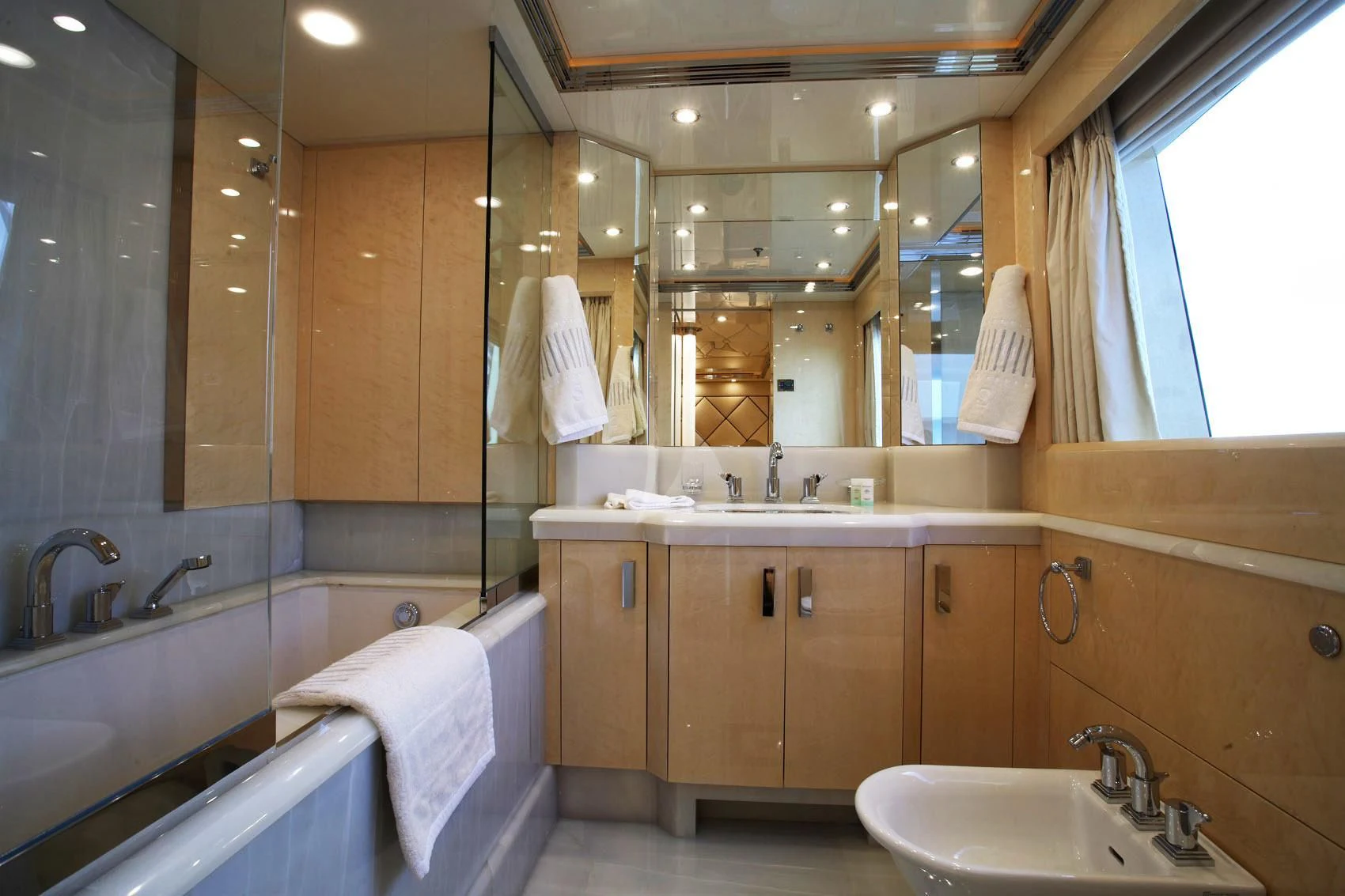 a bathroom with a large mirror aboard SUNDAY Yacht for Charter