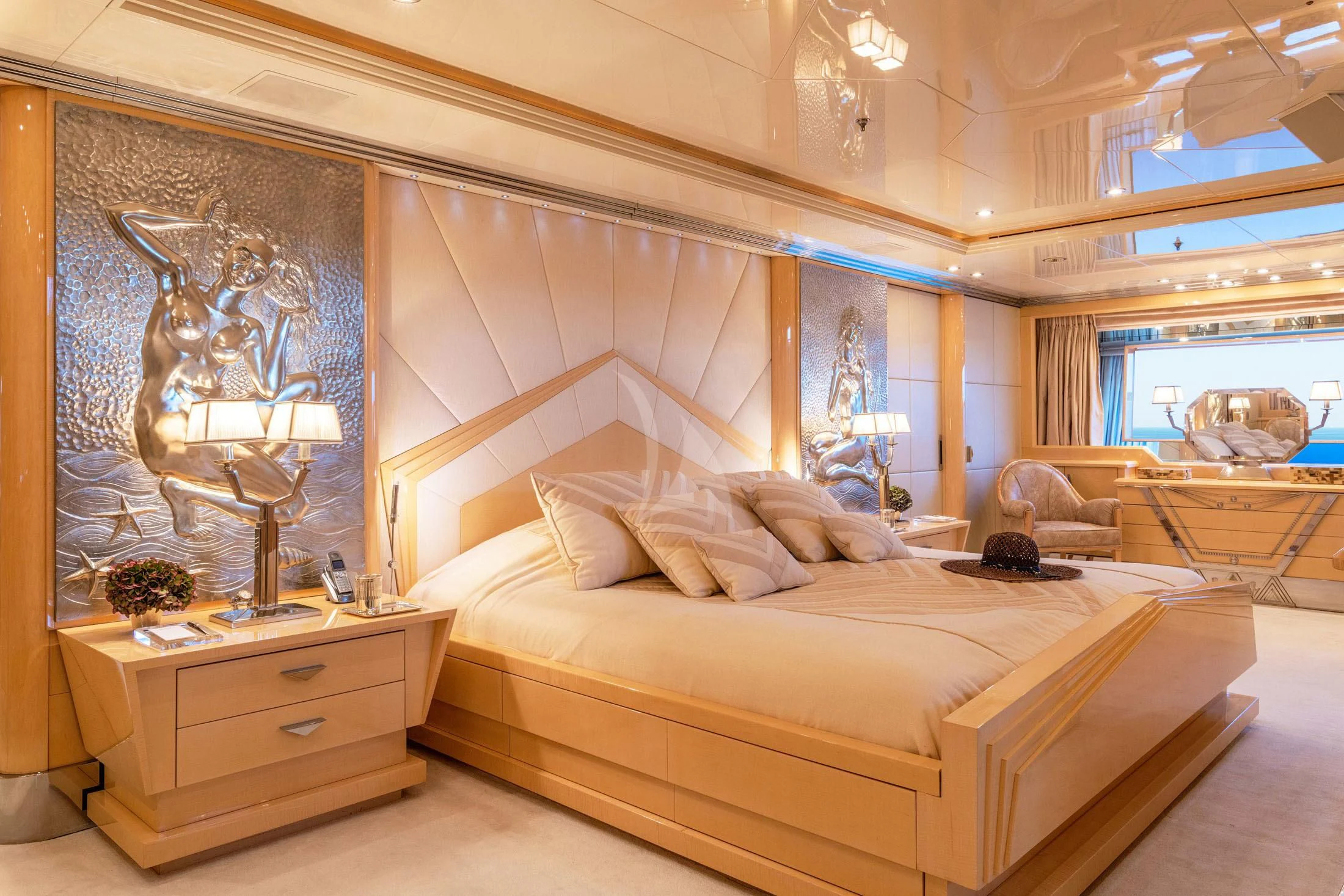 a large bed in a room aboard SUNDAY Yacht for Charter