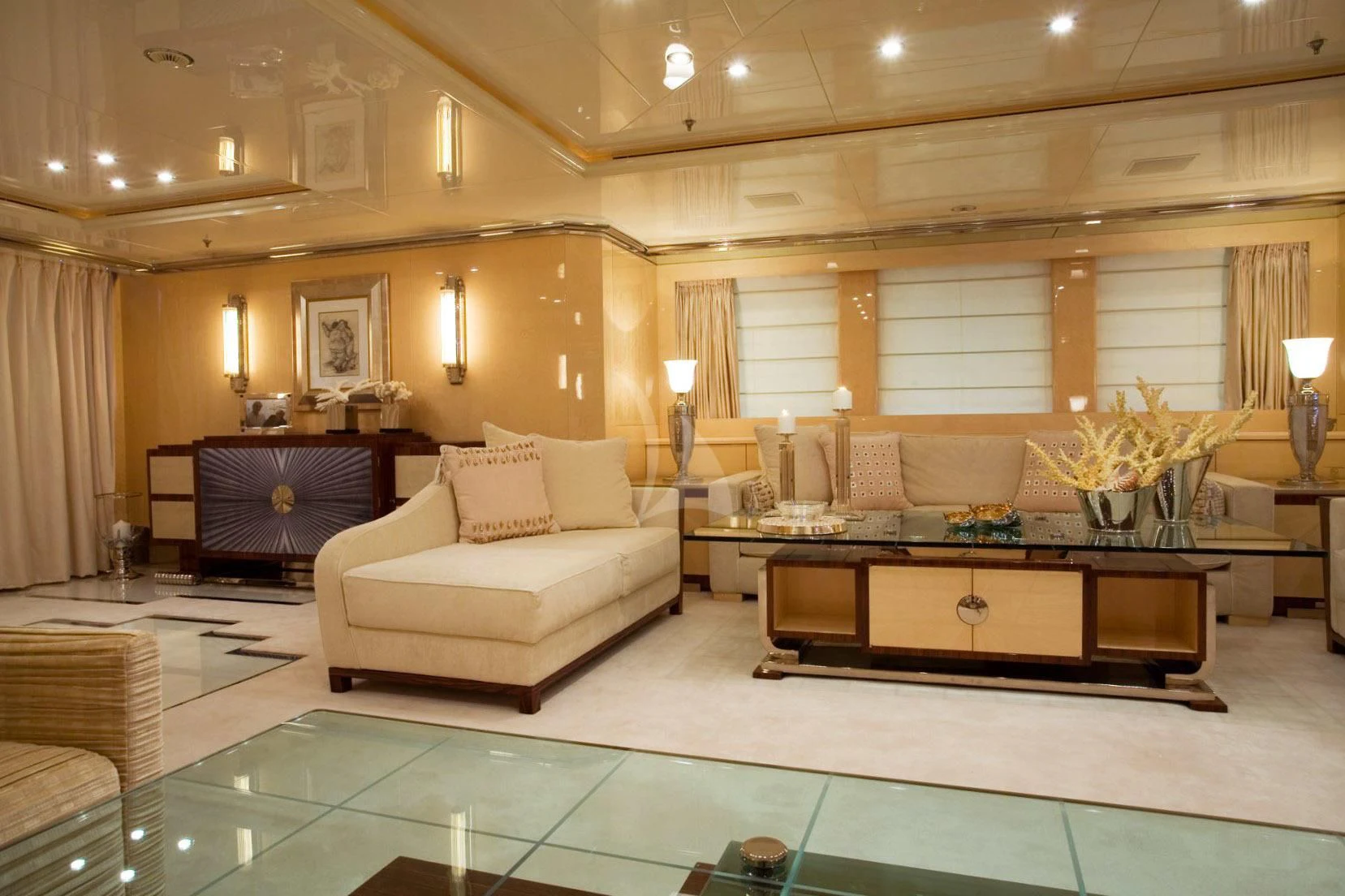 a living room with a large glass floor aboard SUNDAY Yacht for Charter