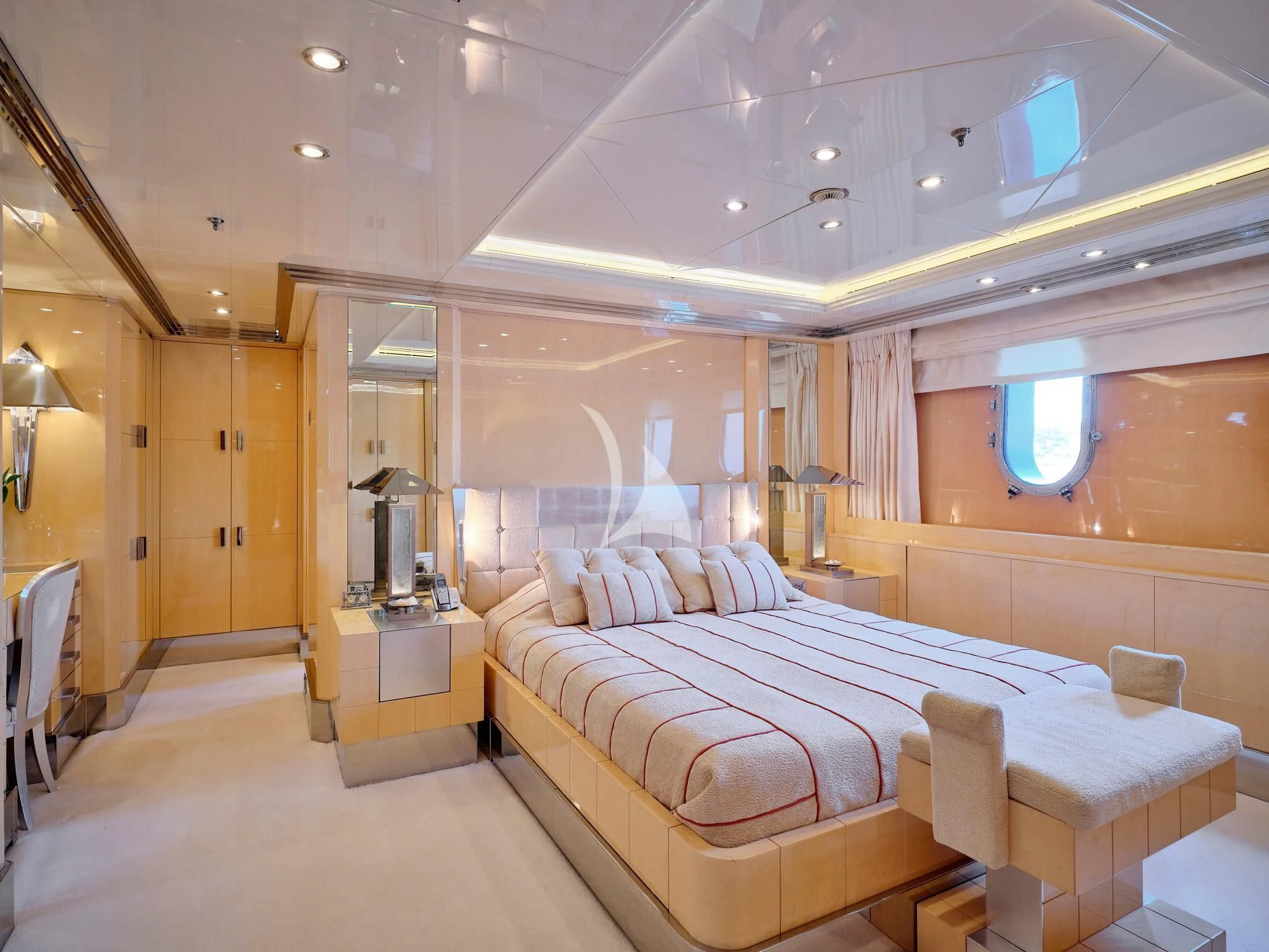 a large bedroom with a bed aboard SUNDAY Yacht for Charter