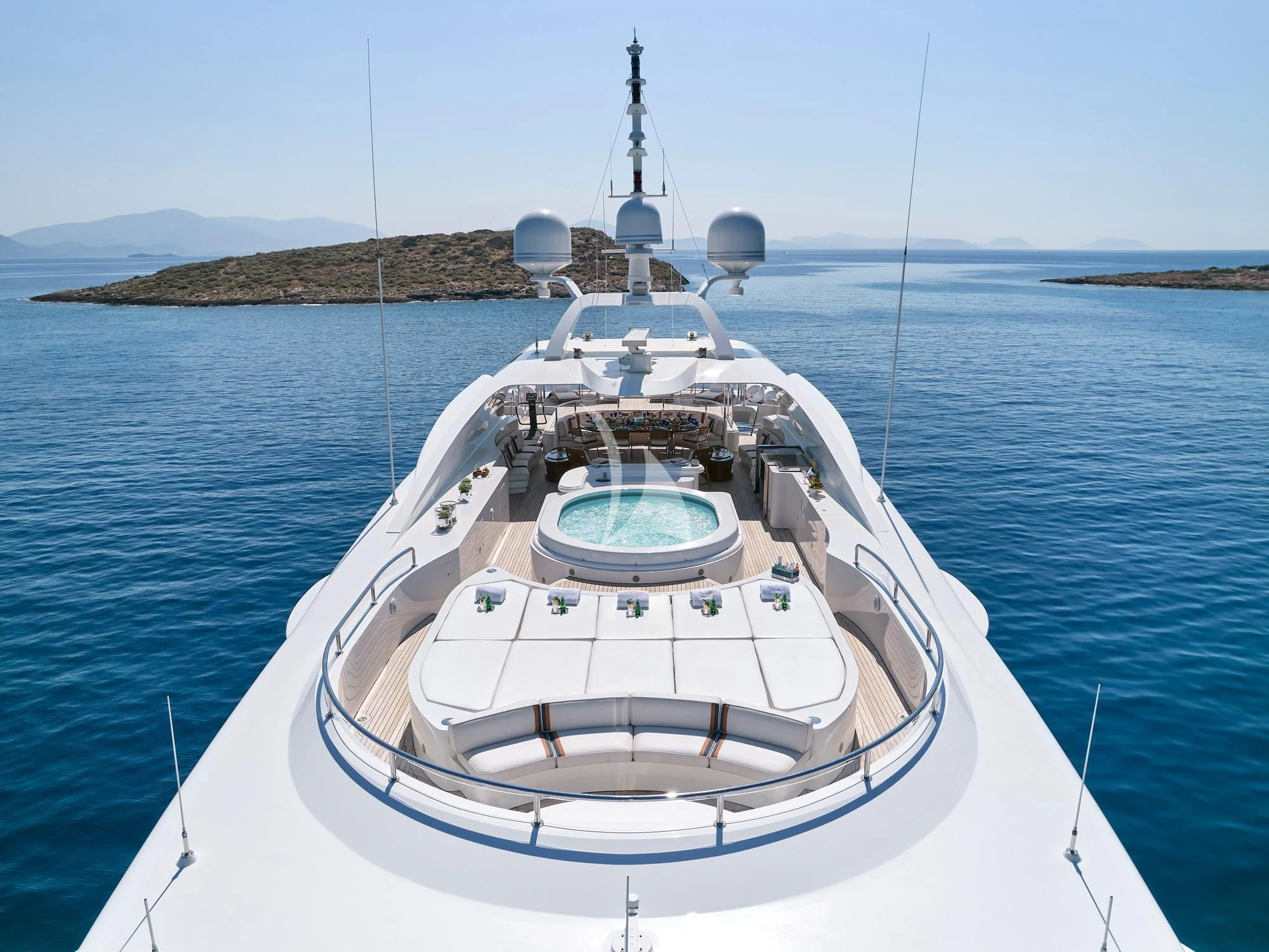 a white boat in the water aboard SUNDAY Yacht for Charter