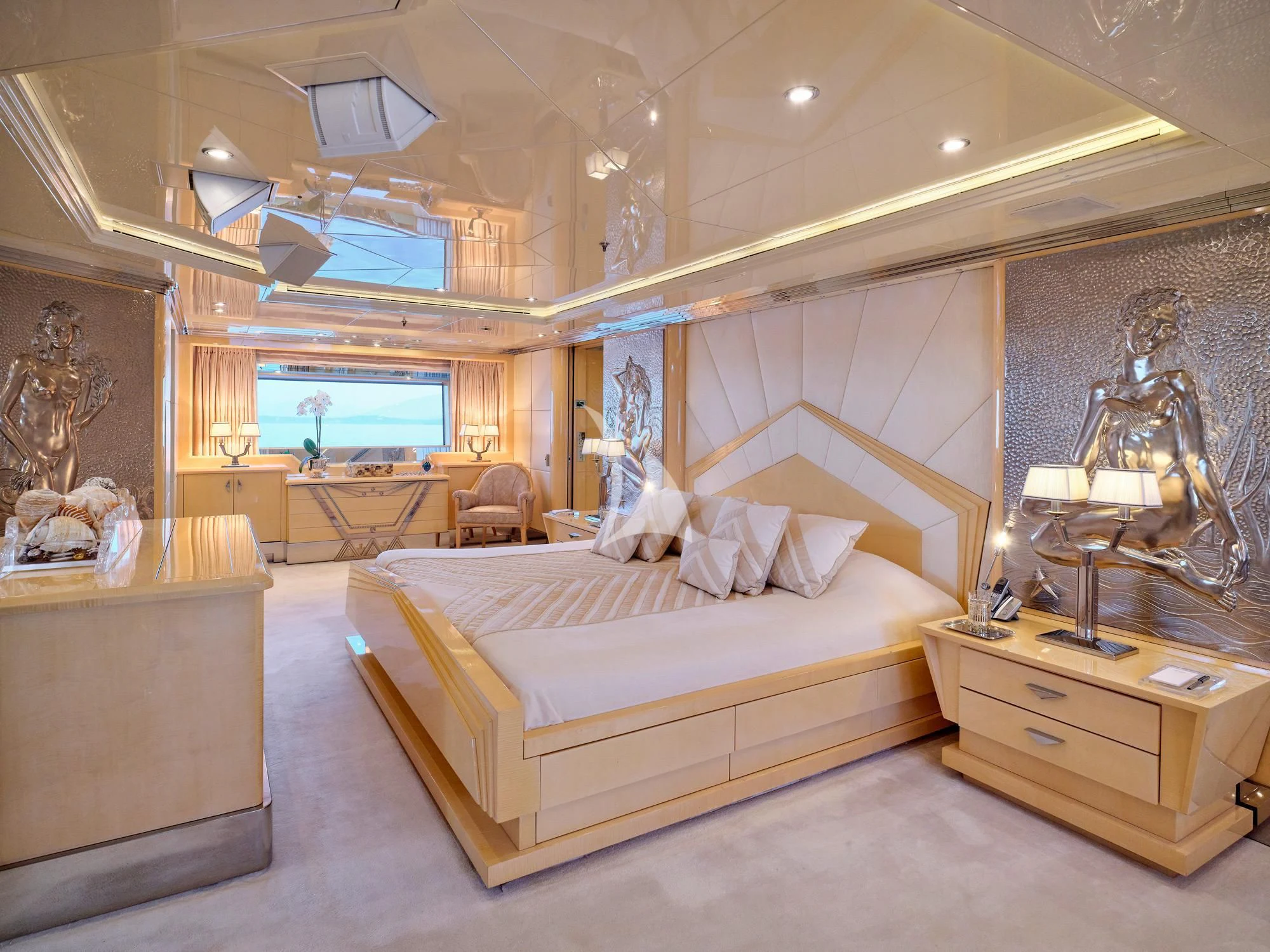 a bedroom with a large bed aboard SUNDAY Yacht for Charter