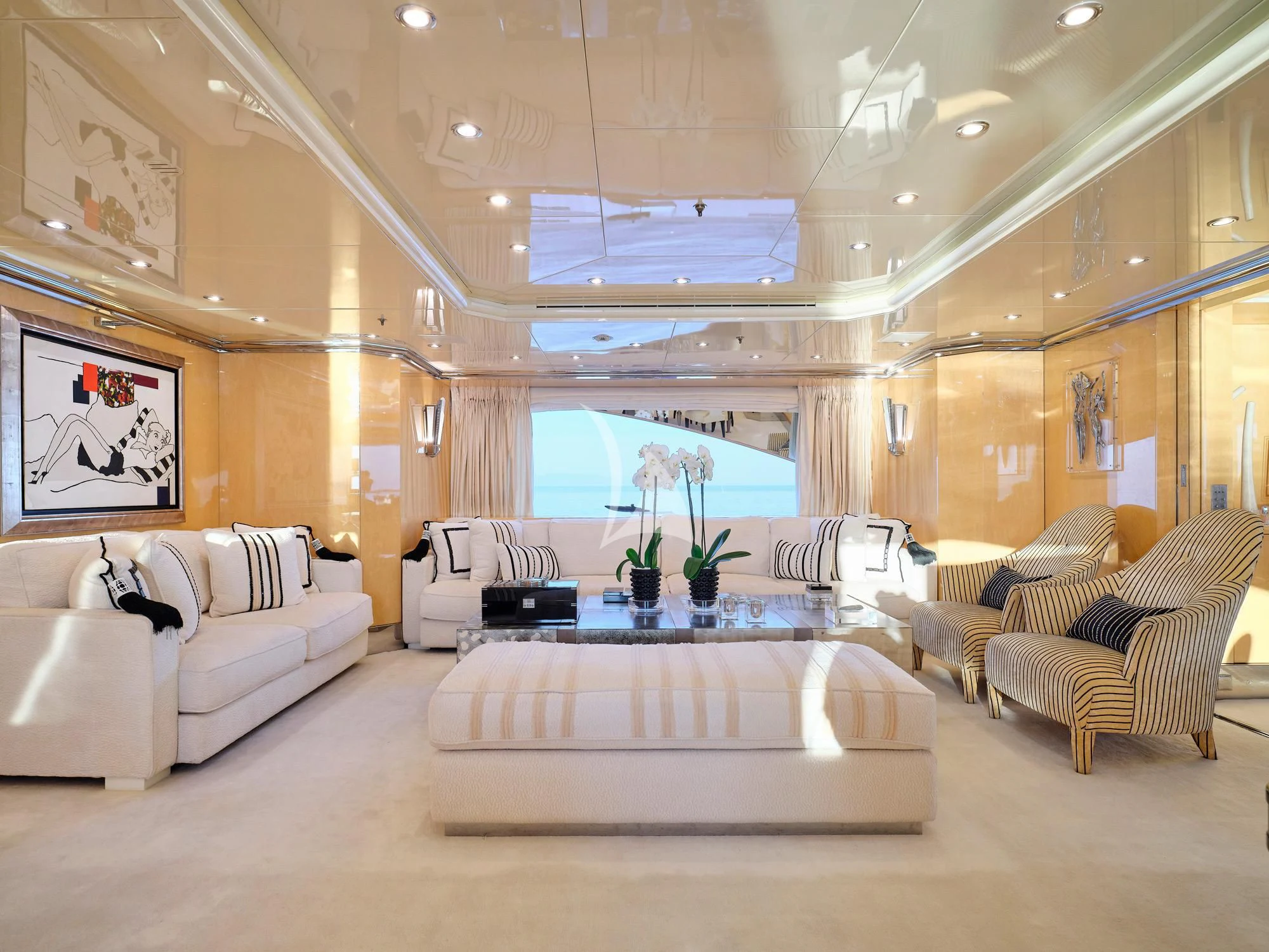 a large living room with a large window aboard SUNDAY Yacht for Charter