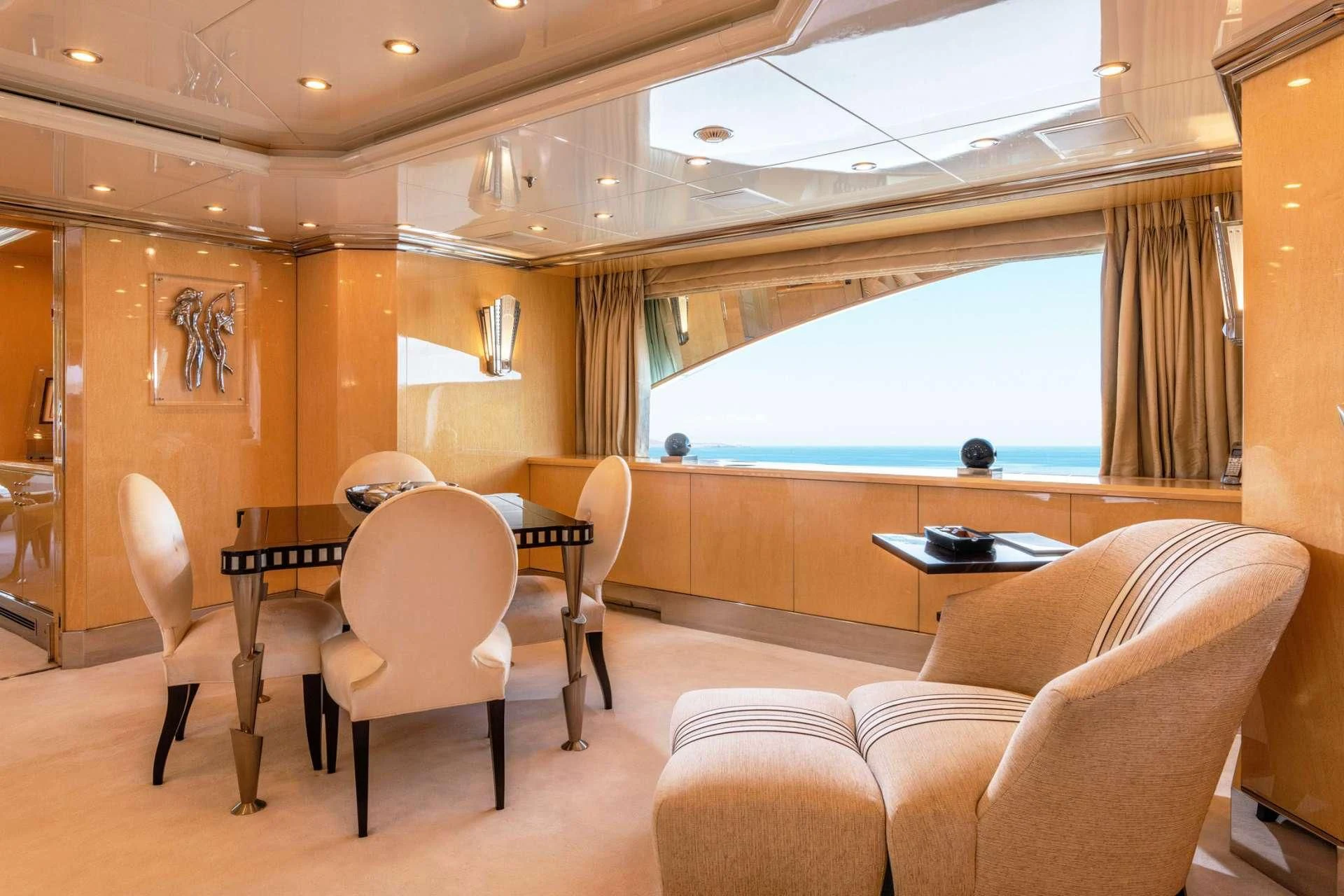 a room with a table and chairs aboard SUNDAY Yacht for Charter