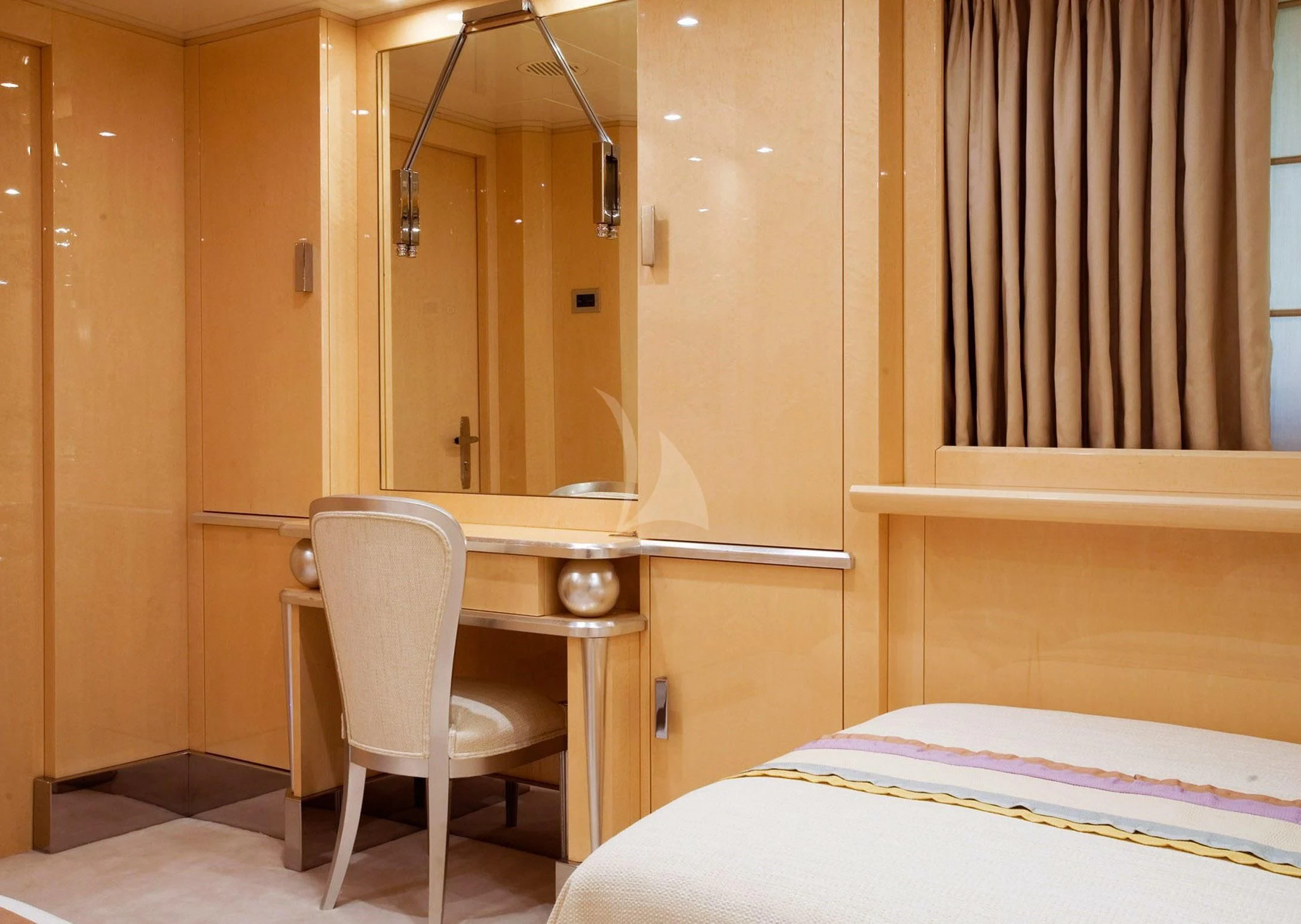 a room with a desk and a bed aboard SUNDAY Yacht for Charter